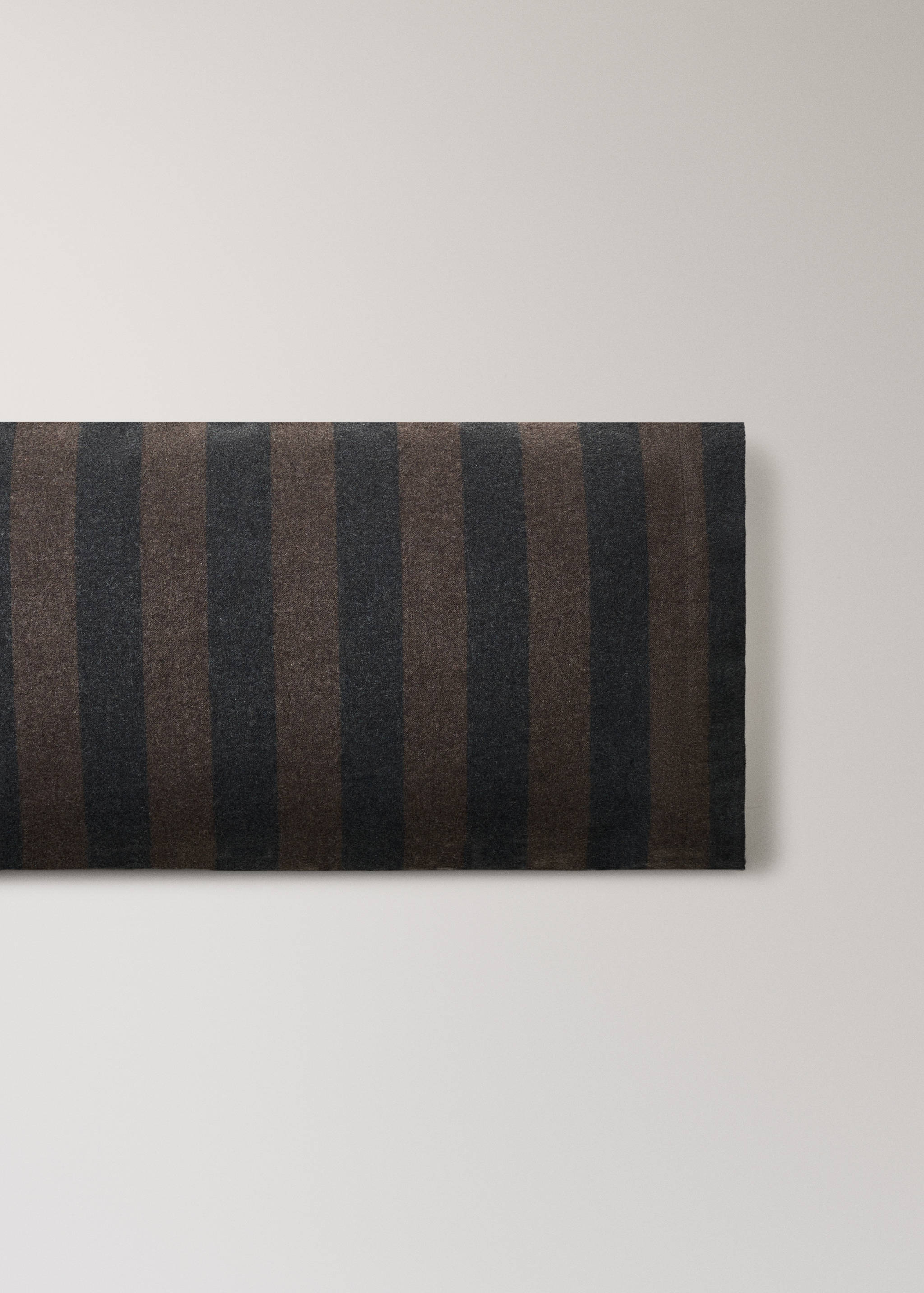 Brown and dark grey striped pillowcase.