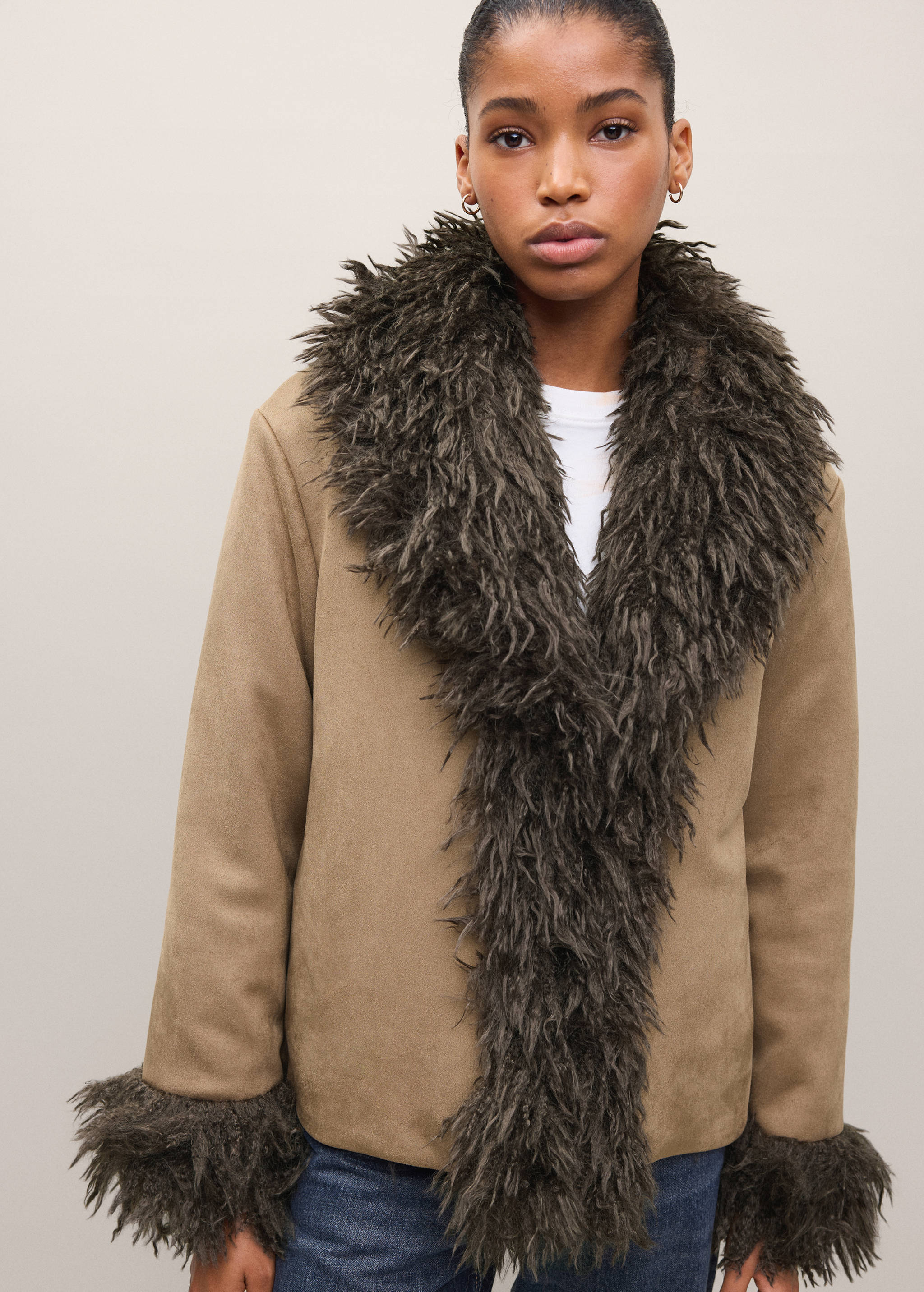 Tan coat with dark grey faux-fur lapel collar and cuffs.