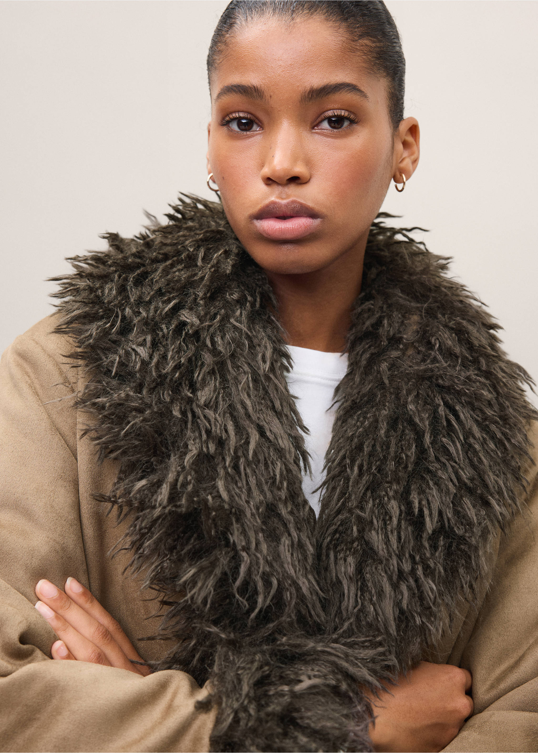 Brown coat with a fluffy dark green faux-fur collar, shown in a close-up., Medium Brown. Ref: 37028285-00.