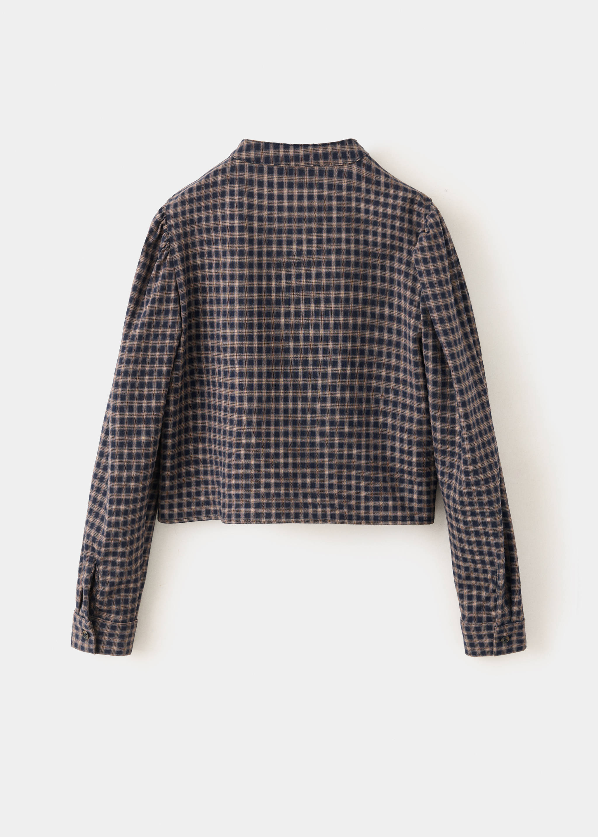 Back view of a blue and beige checkered children's shirt.