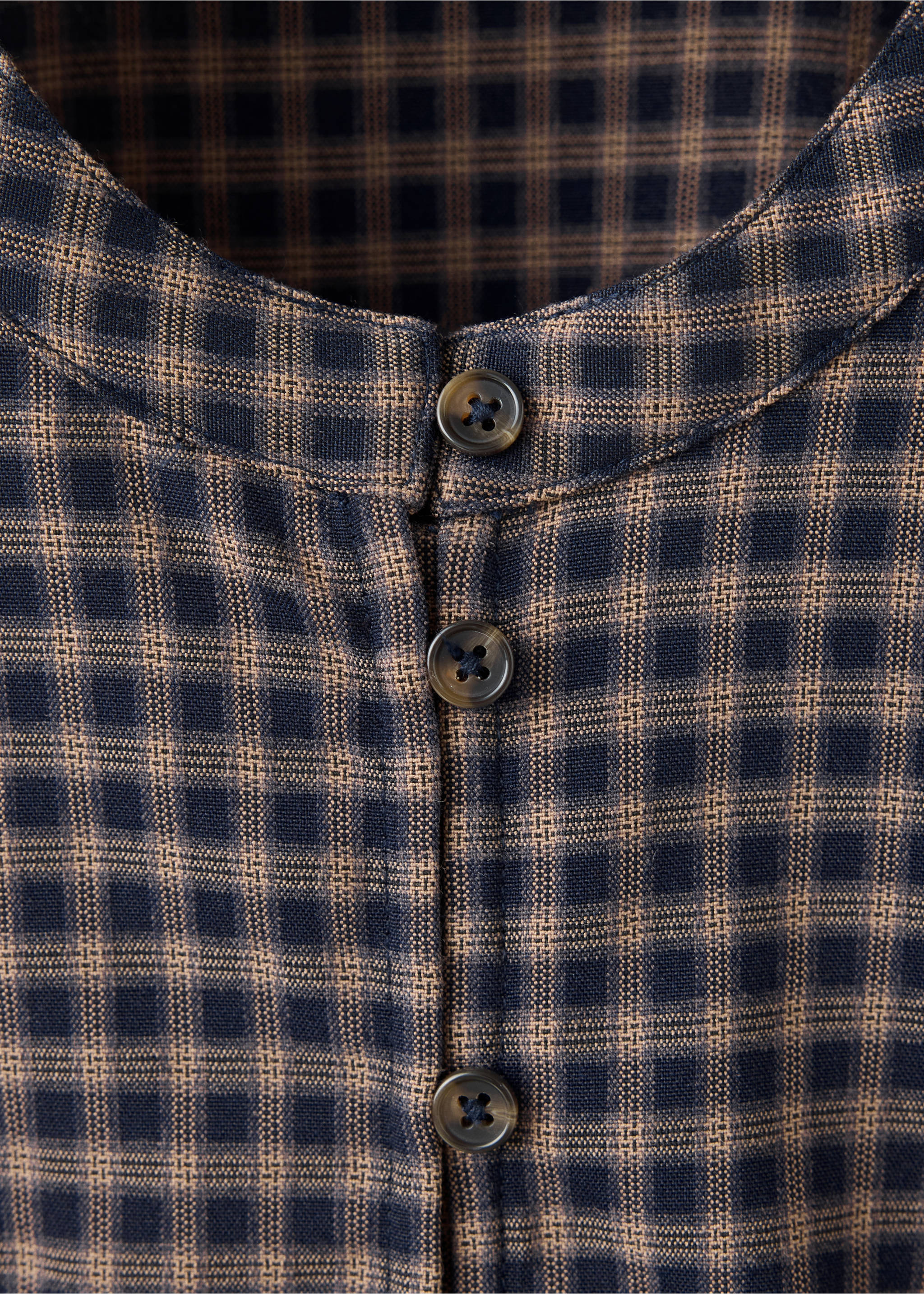 Checkered shirt detail showing the rounded neckline and button placket., Navy. Ref: 37028287-00.