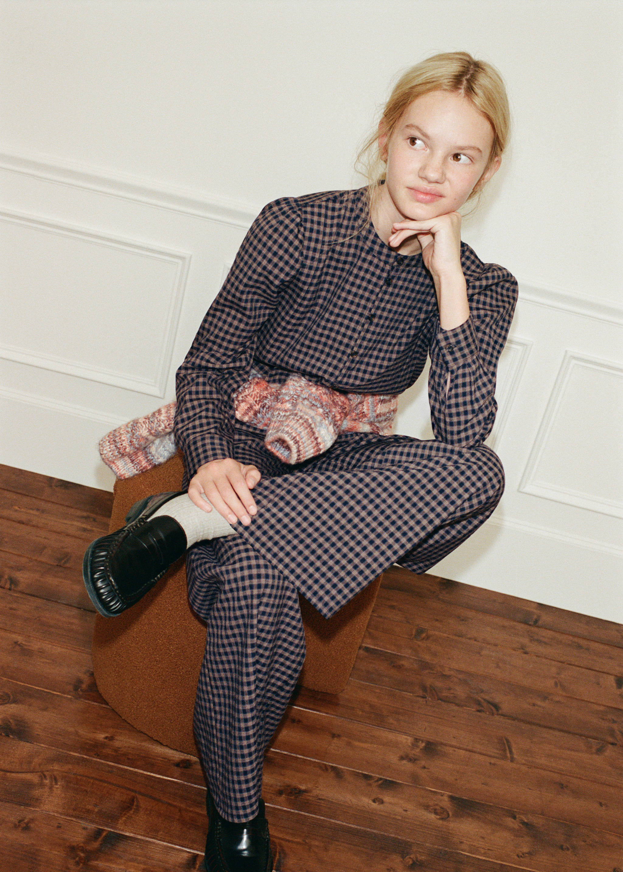 Navy blue and brown check shirt with a round neck and front buttons.