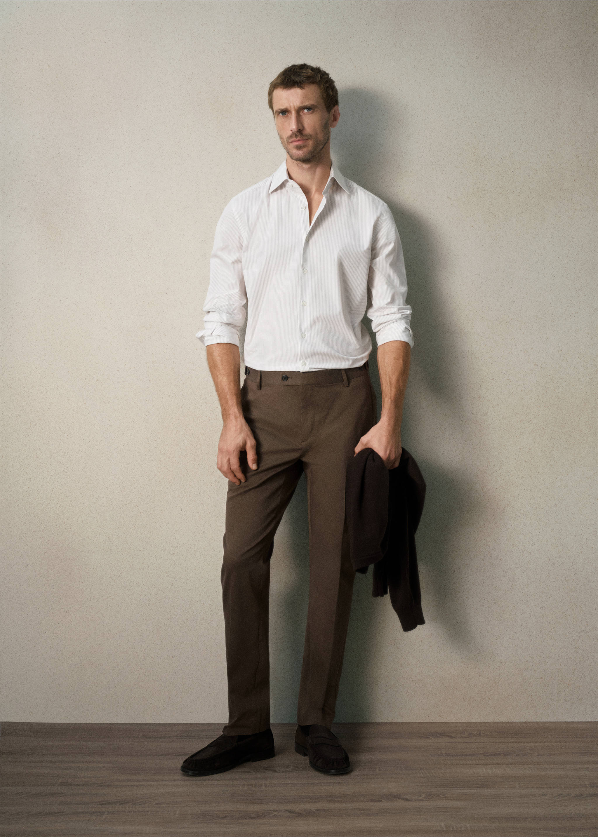 Dark brown trousers worn with a white shirt and dark loafers., Mink Grey. Ref: 37028631-00.