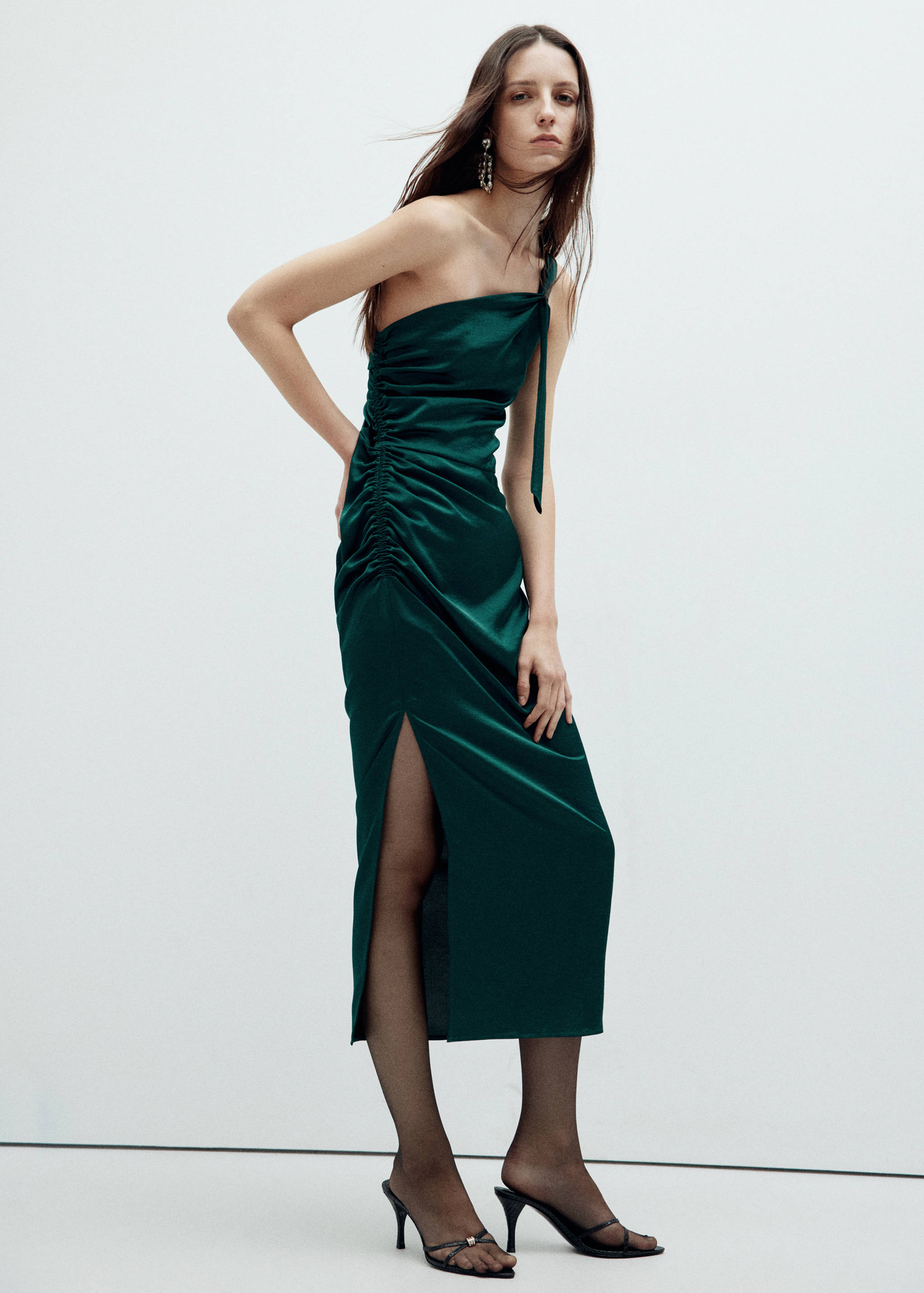 Dark green satin one-shoulder midi dress with side ruching and slit.
