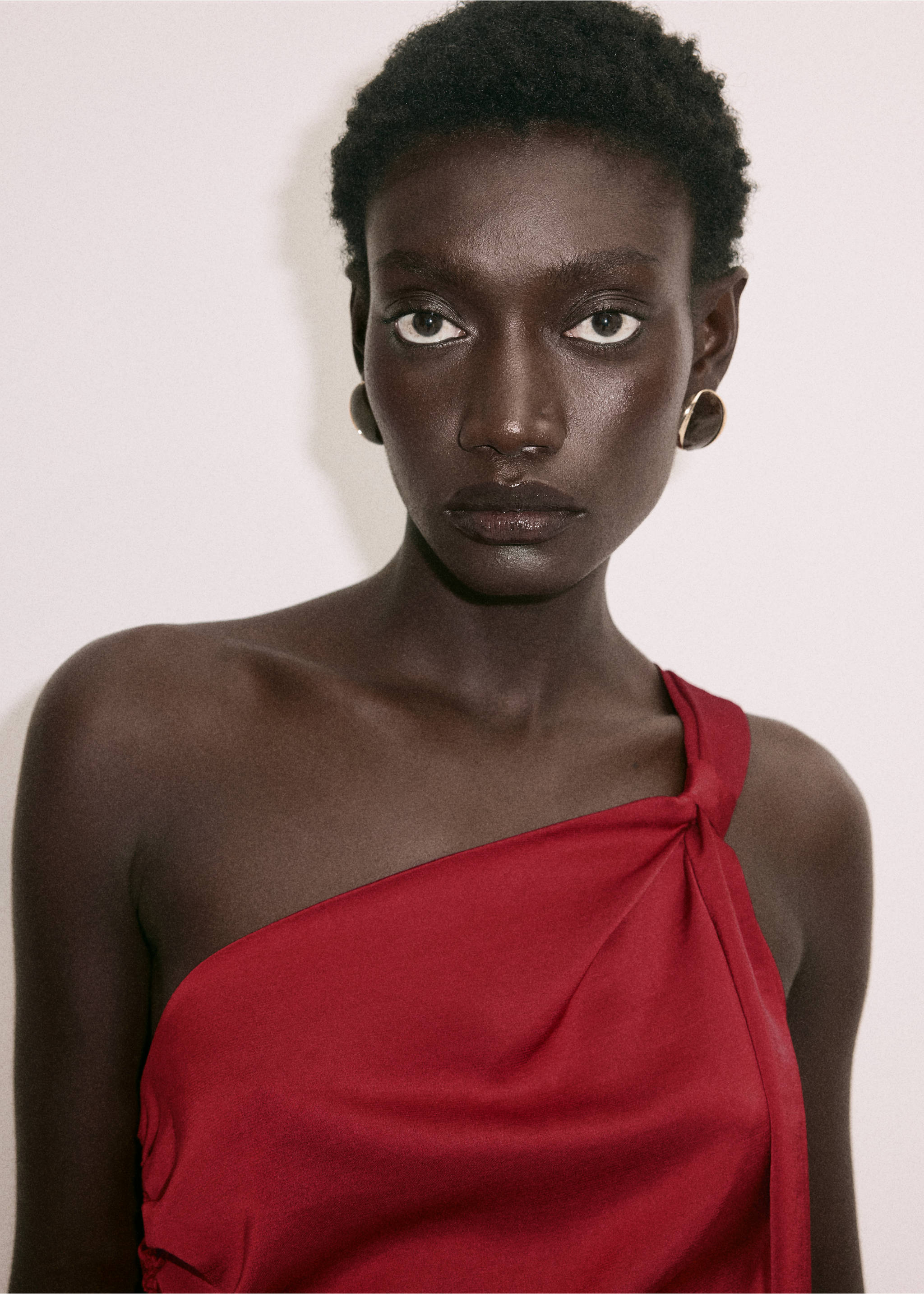 Close-up of a dark red one-shoulder dress with a knotted strap., Cherry. Ref: 37029115-00.
