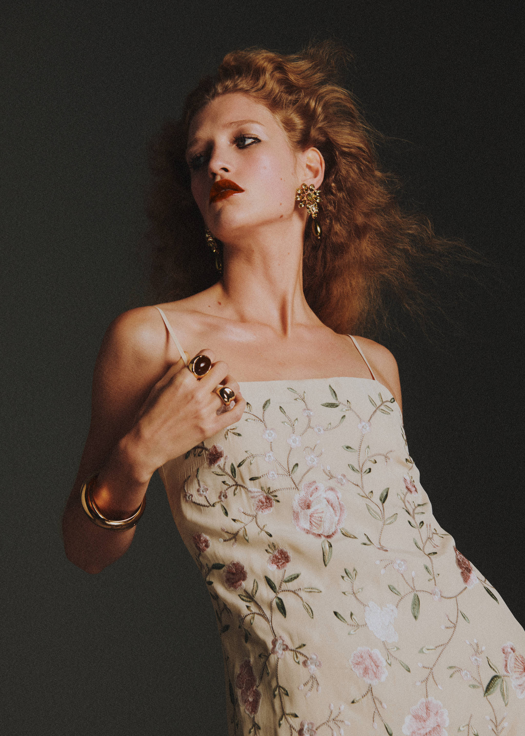 Pale yellow embroidered floral slip dress with thin straps.