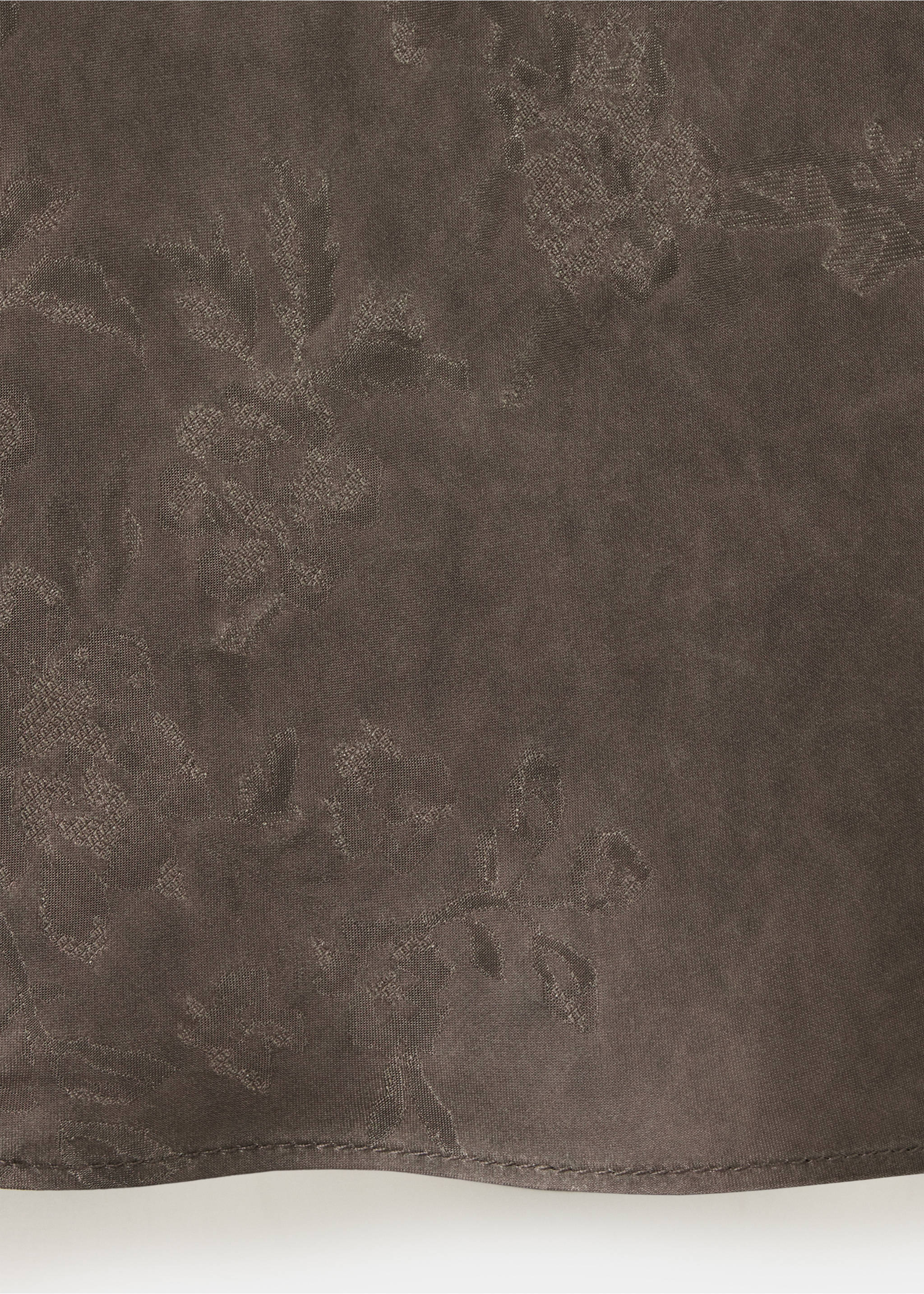 Close-up of brown dress fabric with tonal floral pattern., Brown. Ref: 37029125-00.