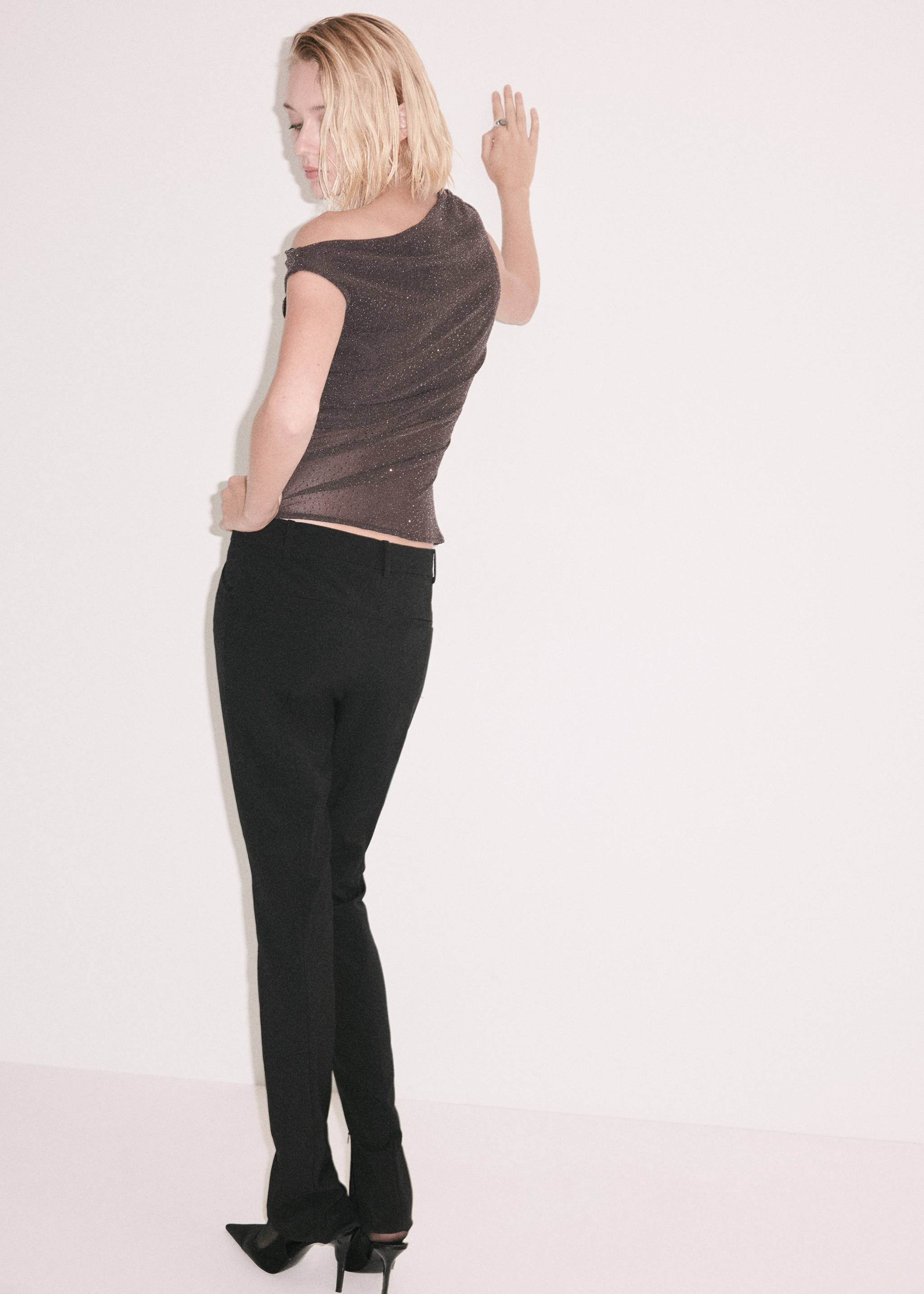 Dark brown shimmer asymmetric top, back view.