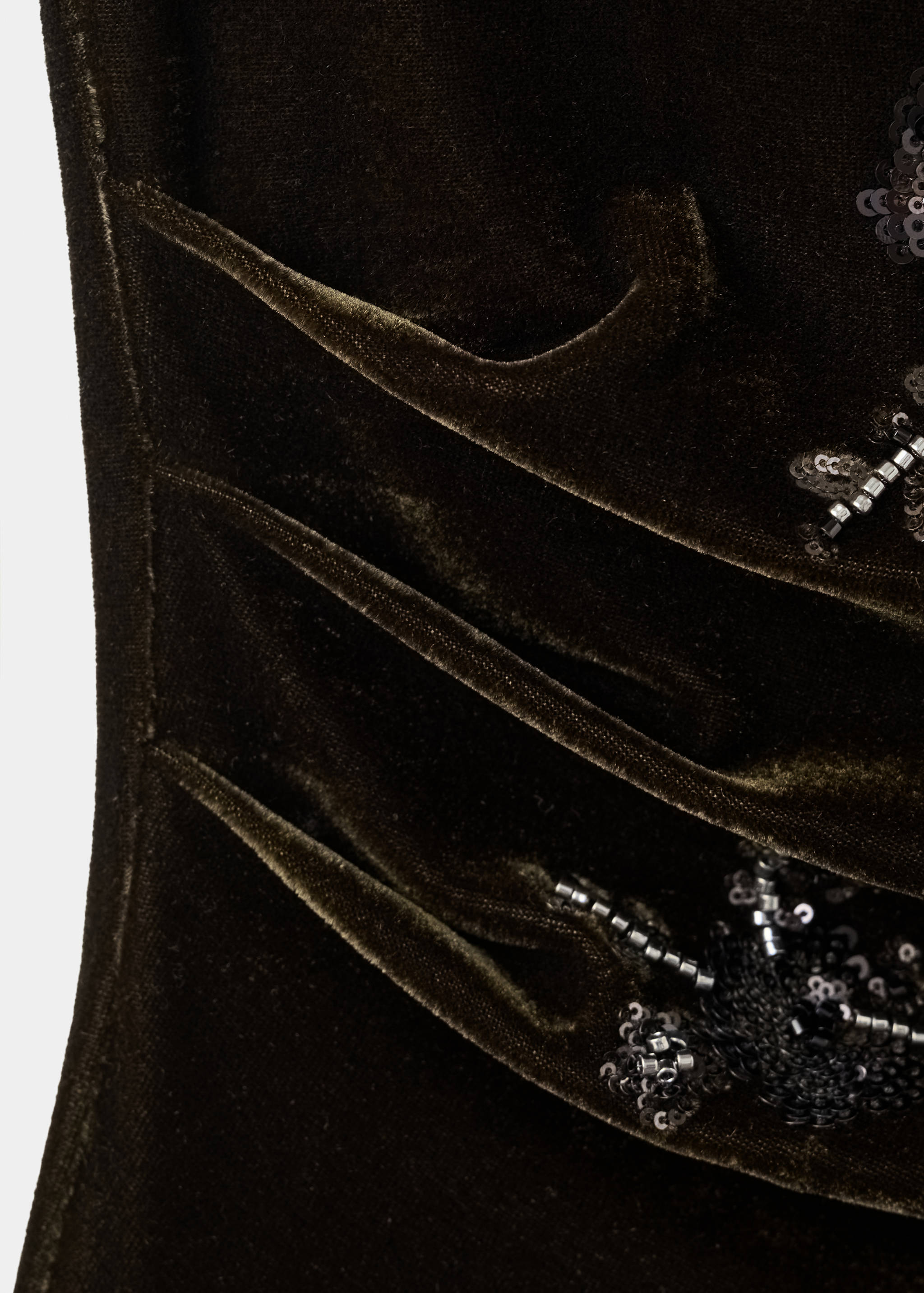 Olive green velvet top fabric detail with pleats and sequins.