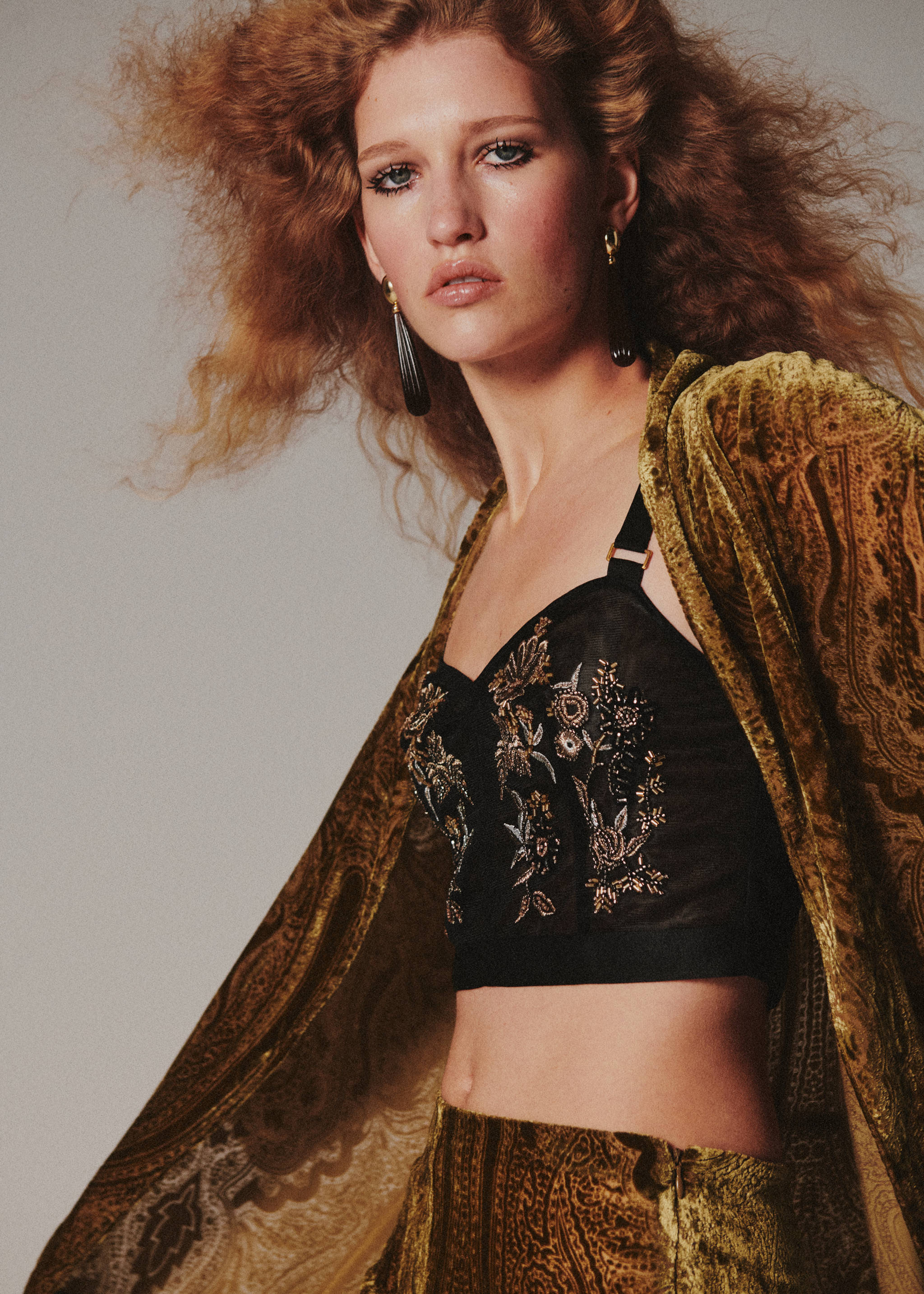 Gold and olive-green patterned velvet poncho worn over a black embroidered bustier top., Green. Ref: 37029129-00.