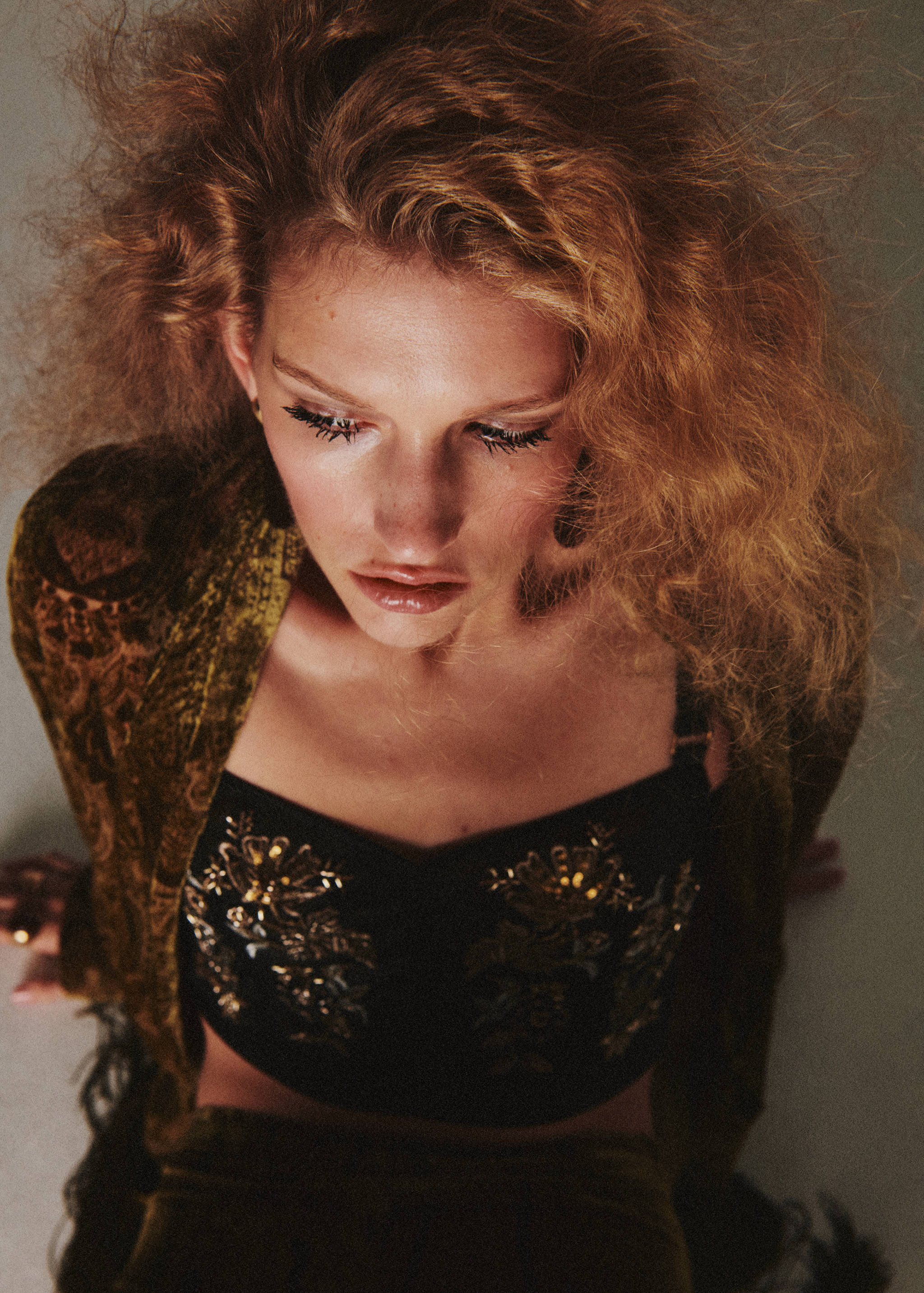 Close-up of a model wearing a fringed olive green patterned poncho., Green. Ref: 37029129-00.