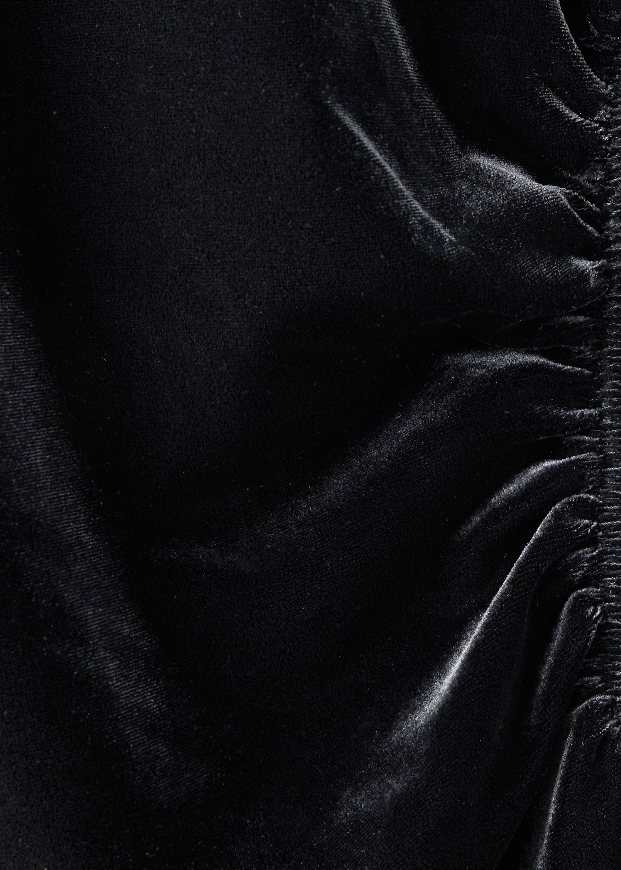 Close-up of a black velvet dress featuring gathered ruching., Black. Ref: 37029133-00.