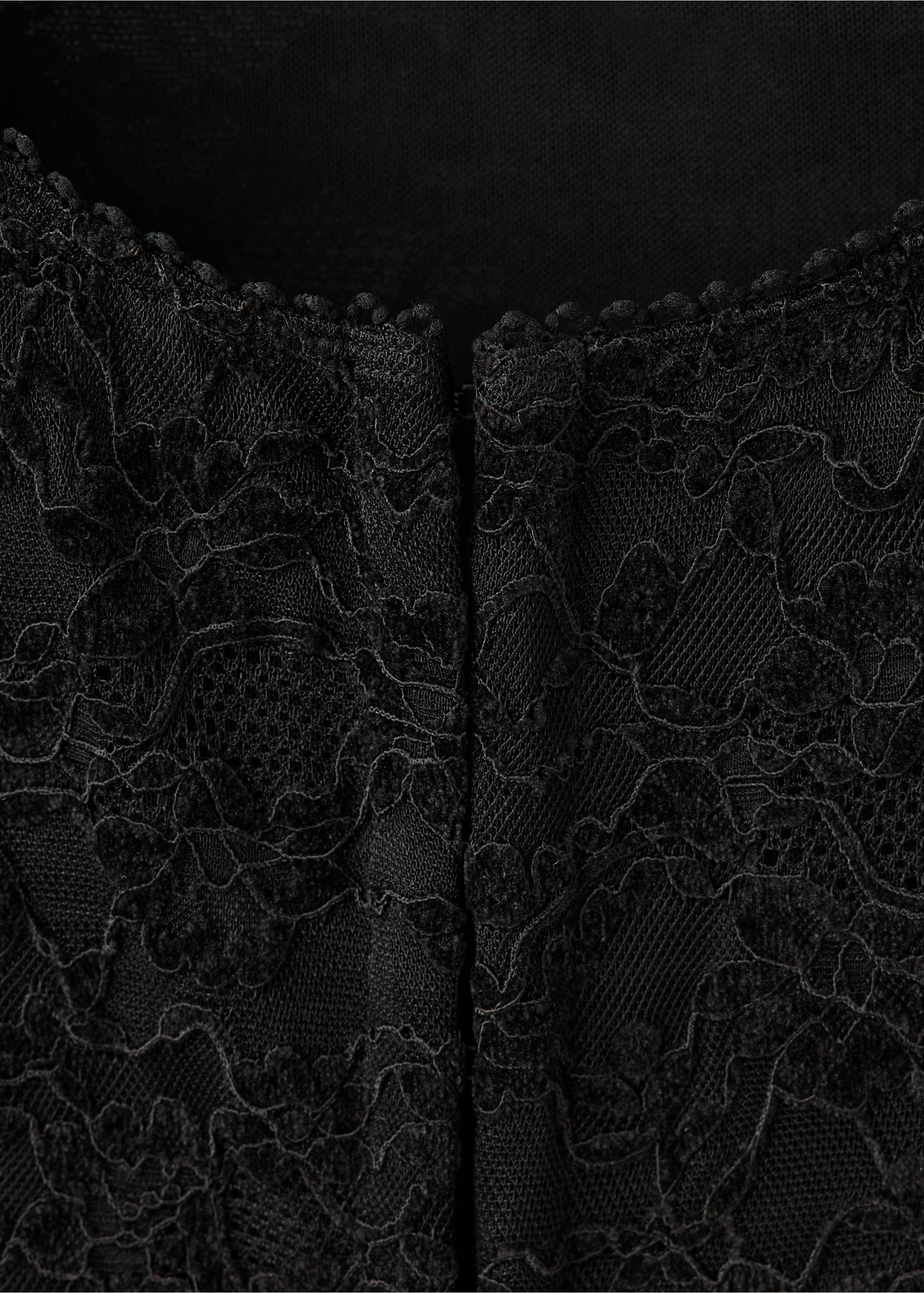Close-up of a black lace top with a scalloped neckline., Black. Ref: 37029134-00.