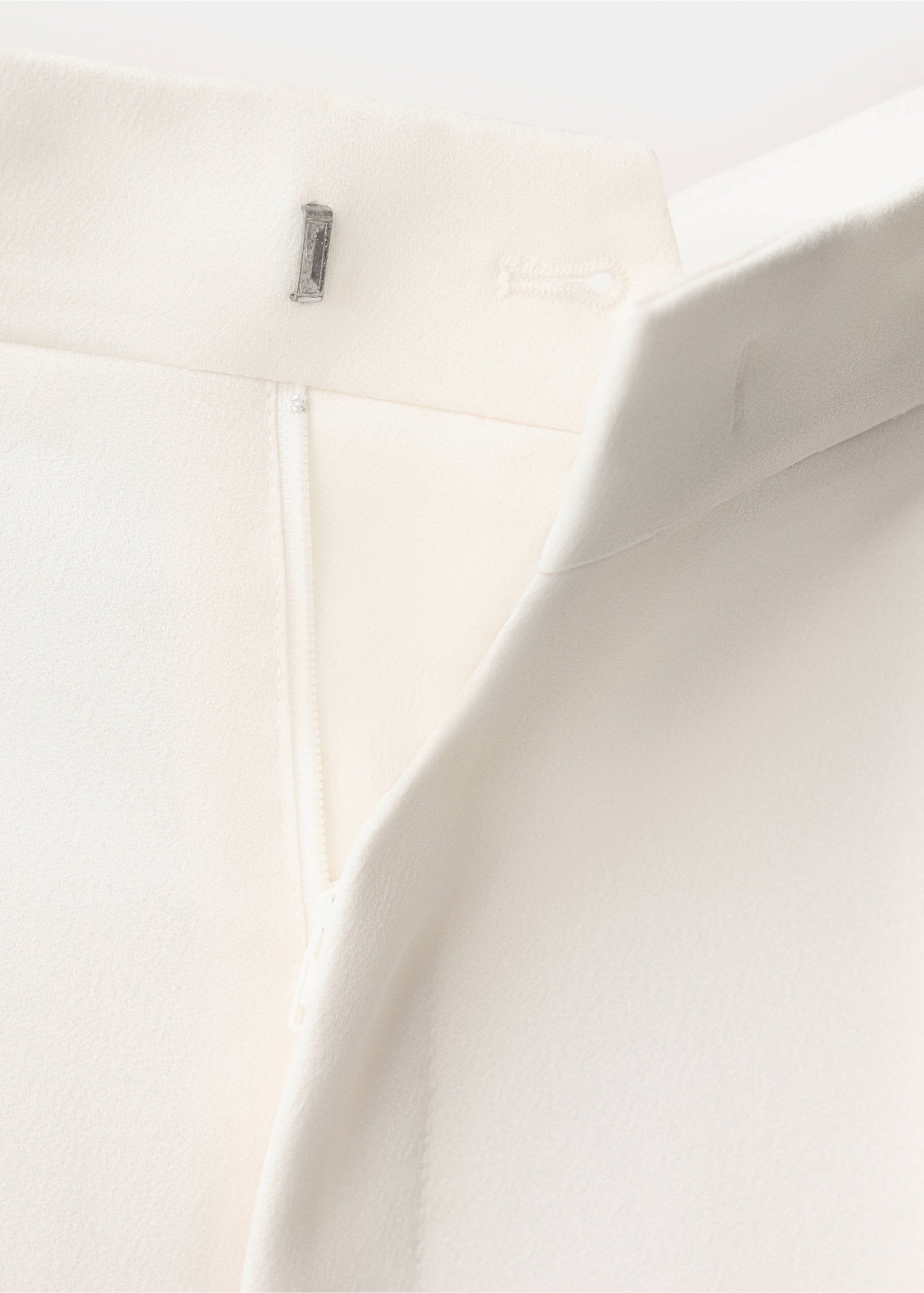 Close-up of white trousers waistband and zip detail., Ecru. Ref: 37029214-00.