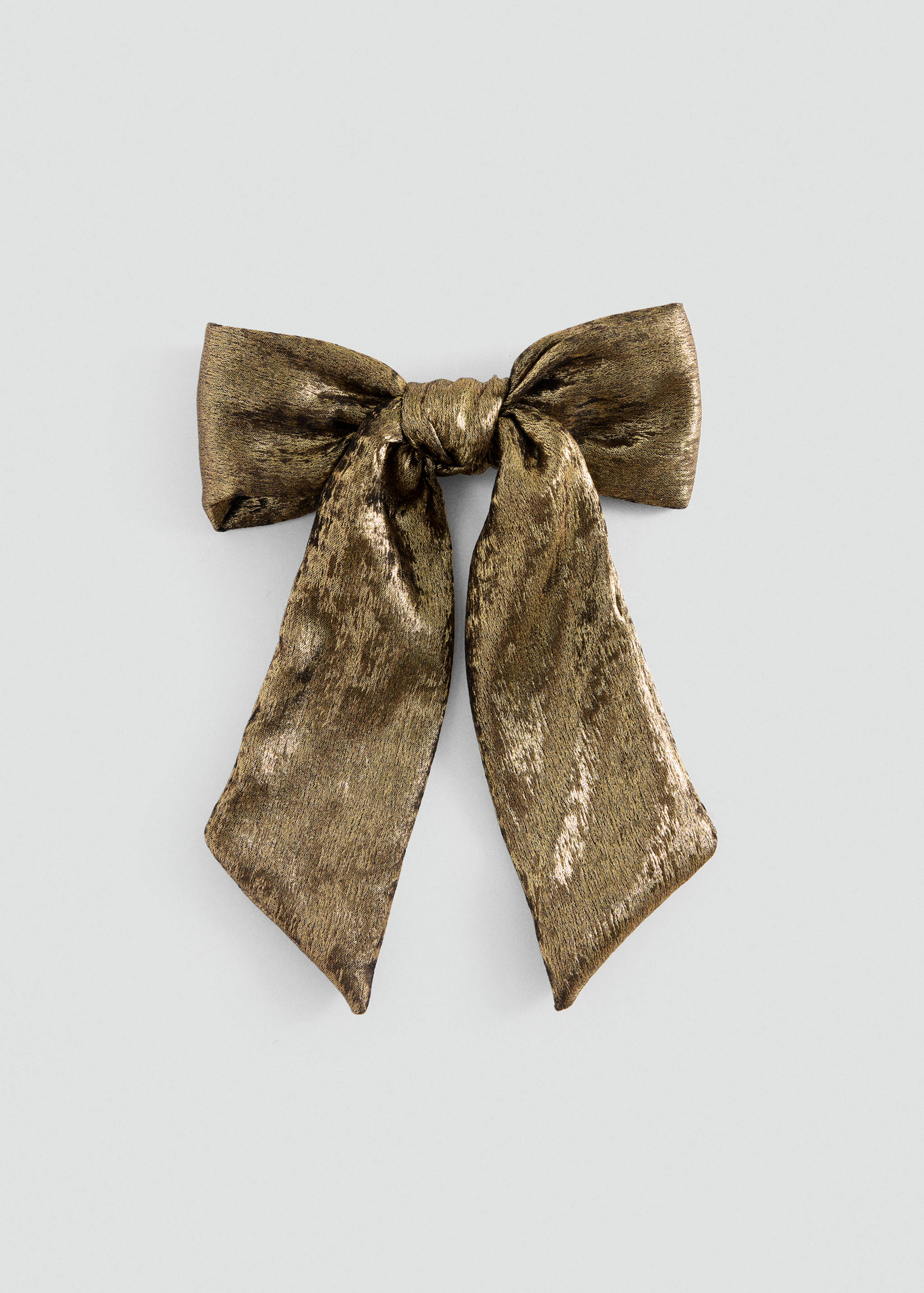 Metallic gold hair bow clip with long textured tails.