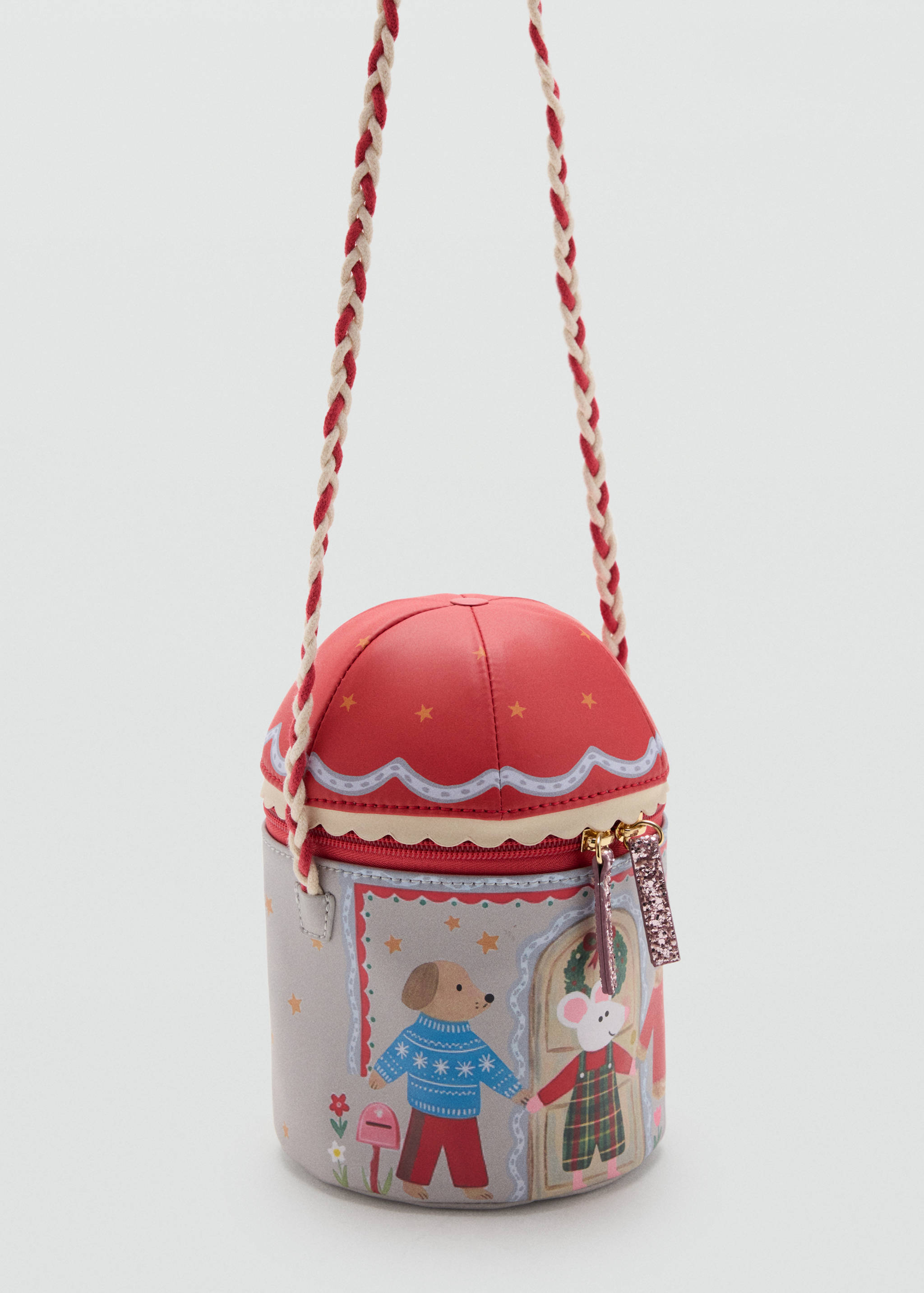 Cylindrical children's crossbody bag in grey and red with holiday illustration and braided strap.
