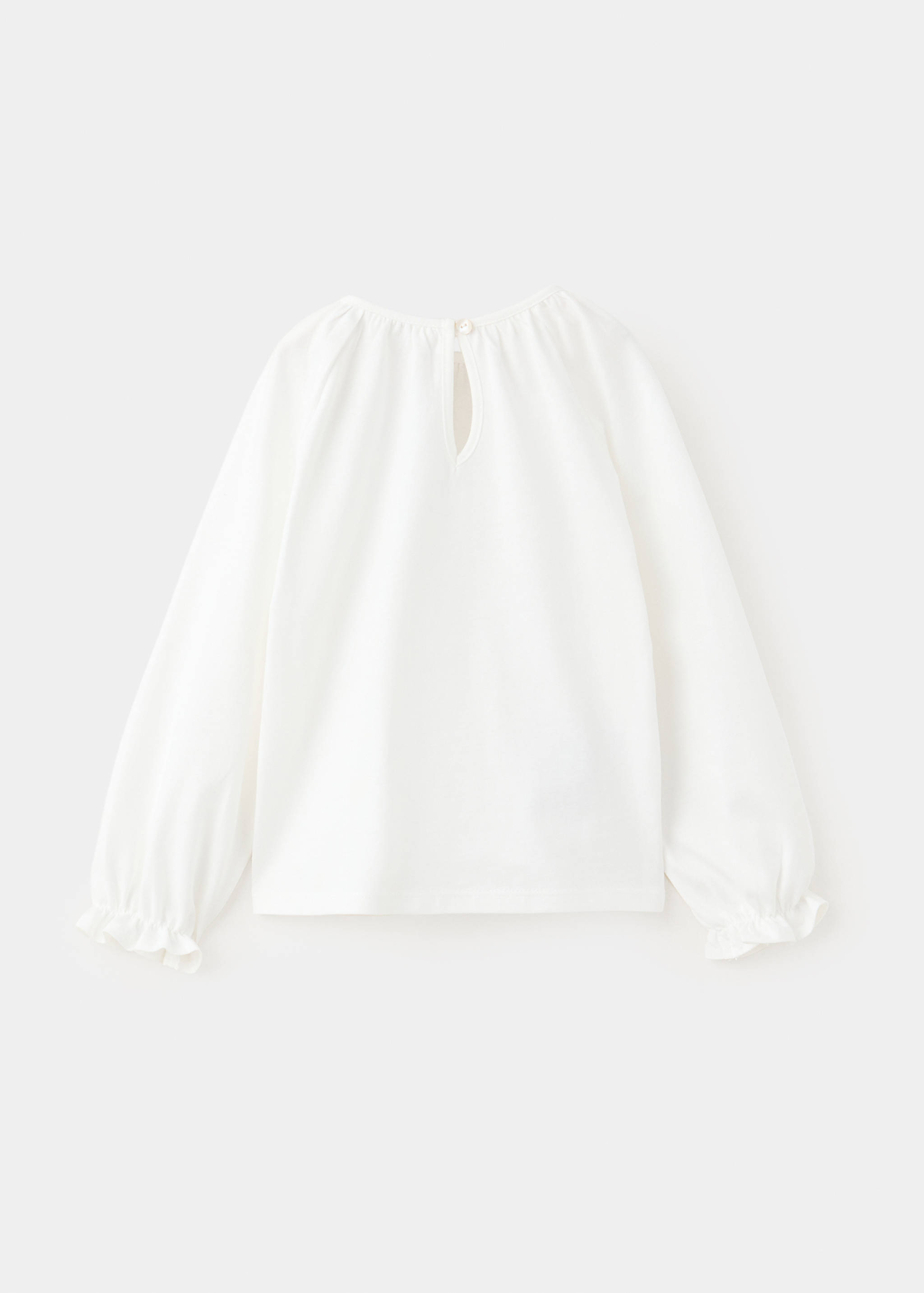 White long-sleeved t-shirt with ruffled cuffs and back button cutout, back view