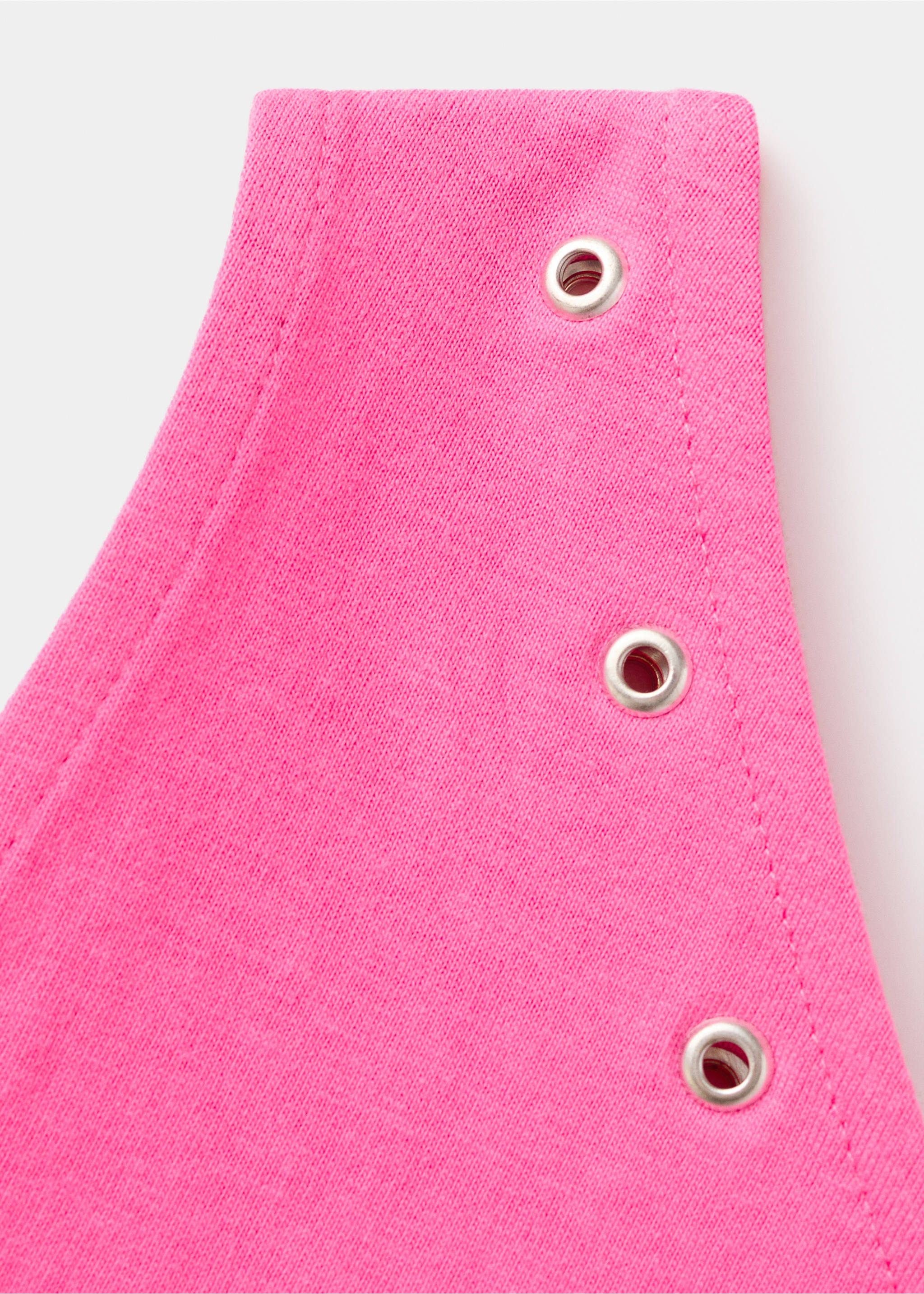 Asymmetric eyelets top - Details of the article 8, Neon Pink. Ref: 37031356-00.