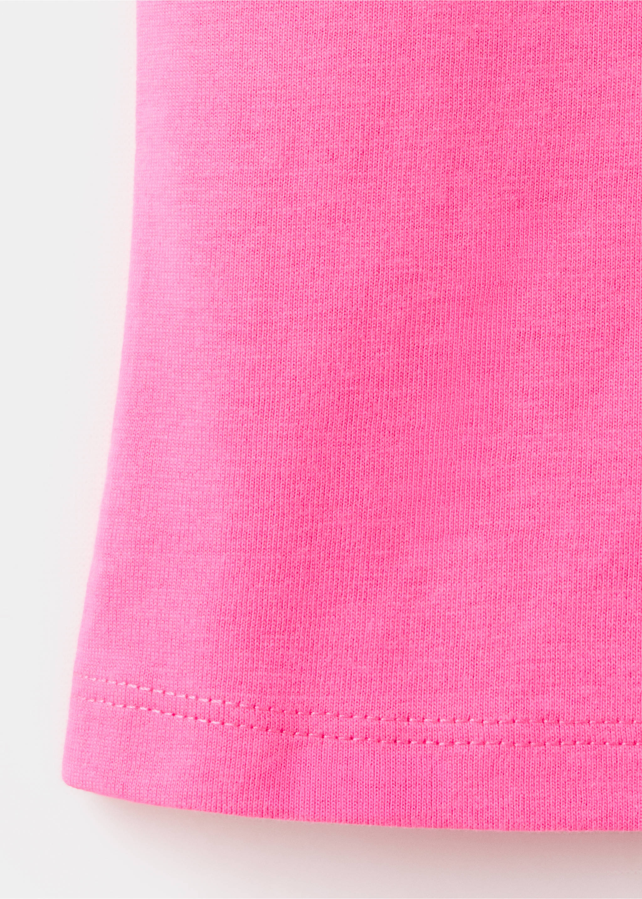 Top asimétrico eyelets - Detalle del artículo 0, Rosa fluor. Ref: 37031356-00.