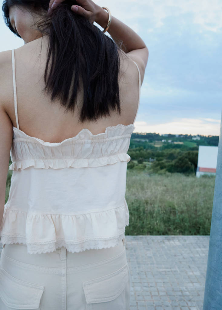 Ruffled top with embroidered details — Ecru