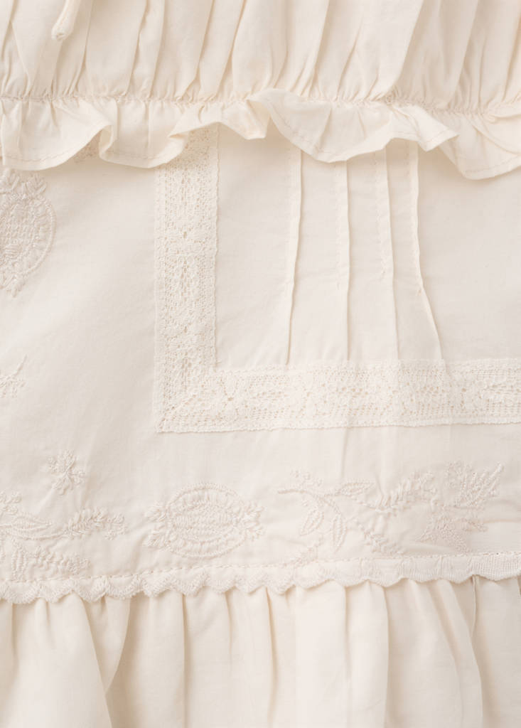 Ruffled top with embroidered details — Ecru