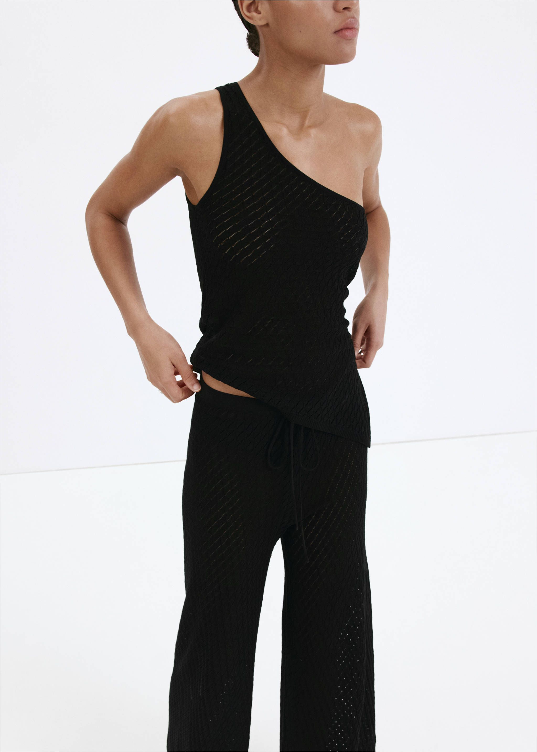 Straight-fit openwork knitted trousers - Details of the article 1, Black. Ref: 37031391-00.