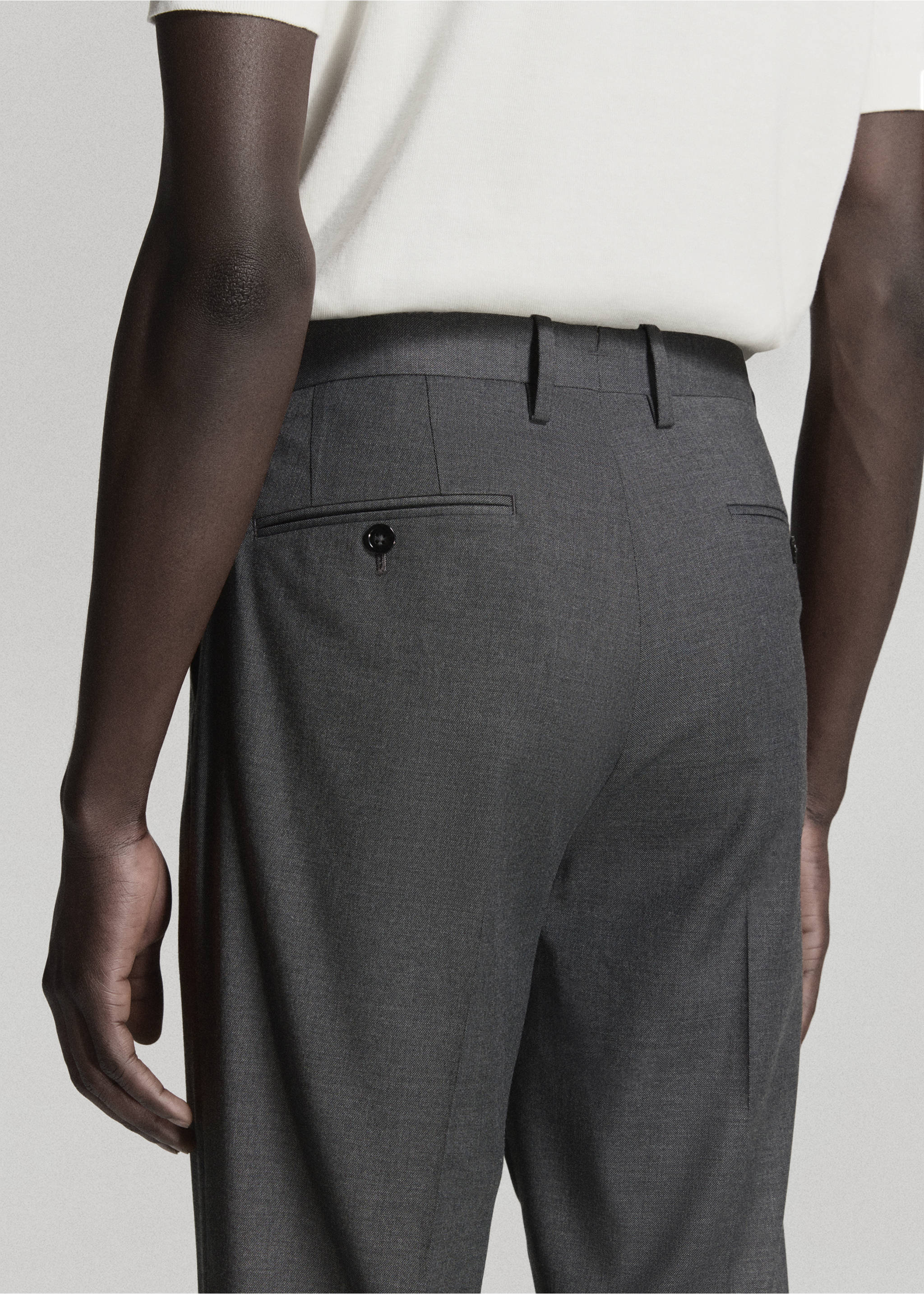 Dark grey trousers with belt loops and buttoned back pockets, seen from behind., Grey. Ref: 37031409-01.