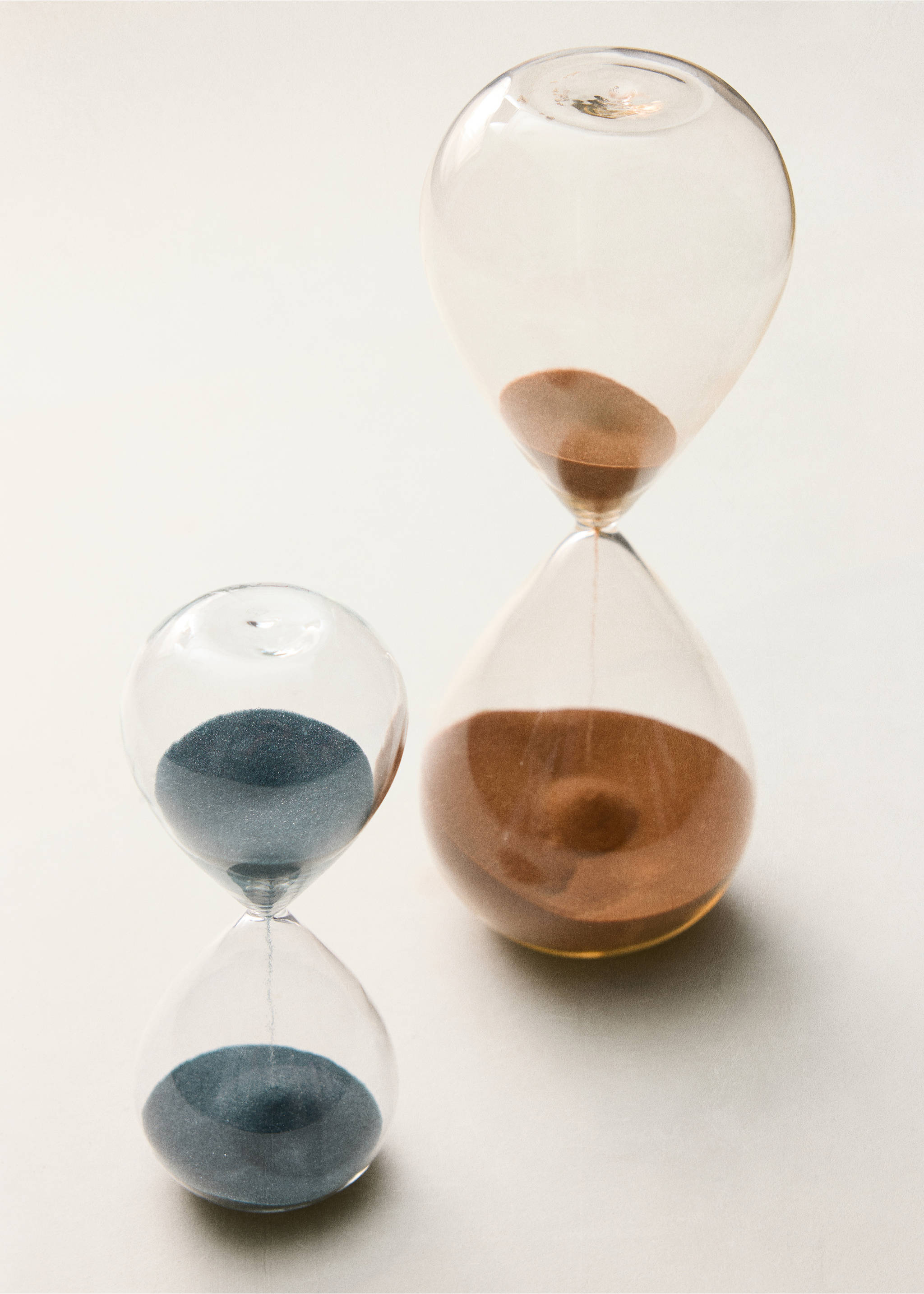 Two glass hourglasses with brown and dark blue sand., Black. Ref: 37033283-00.