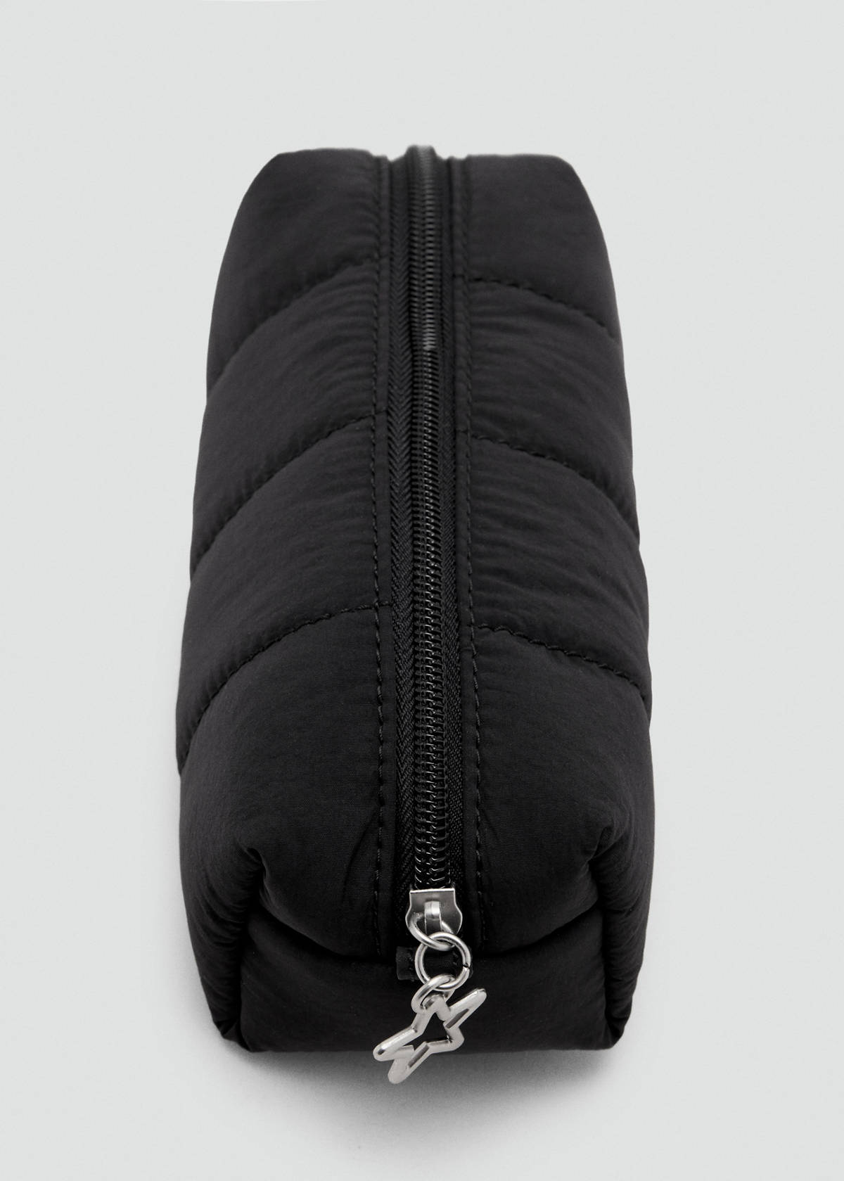 Quilted pouch with star detail — Black