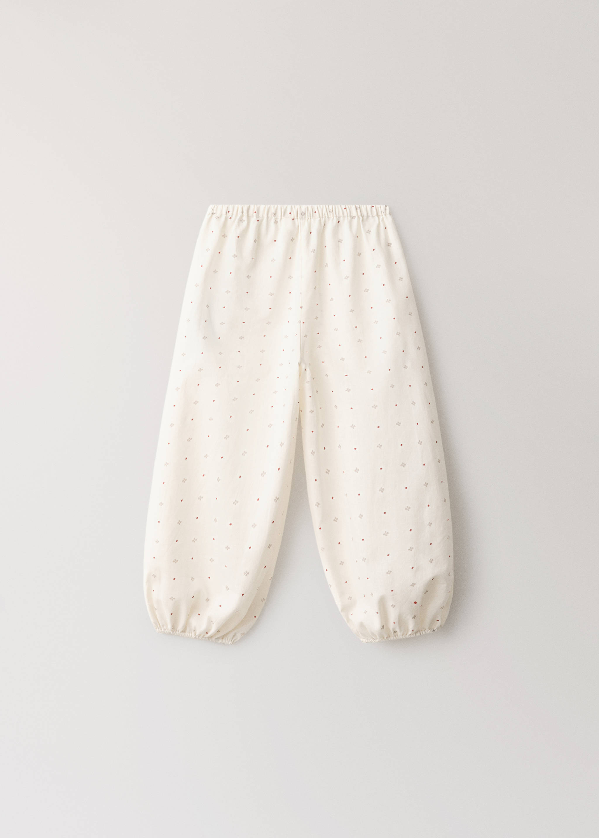 Off-white patterned pyjama trousers with an elasticated waist and cuffs.