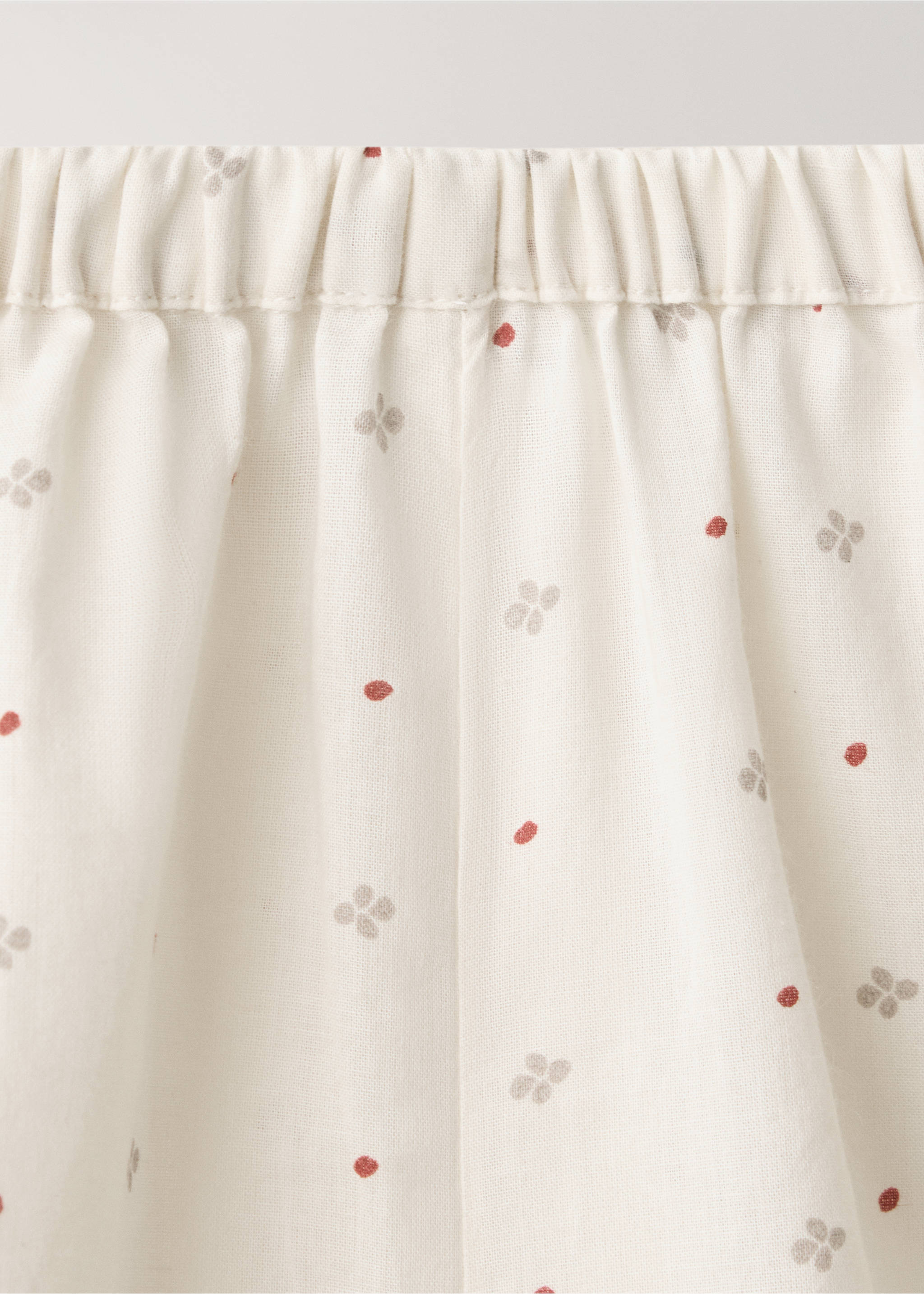 Close-up of the elasticated waistband on cream patterned pyjama trousers., Off White. Ref: 37034454-00.