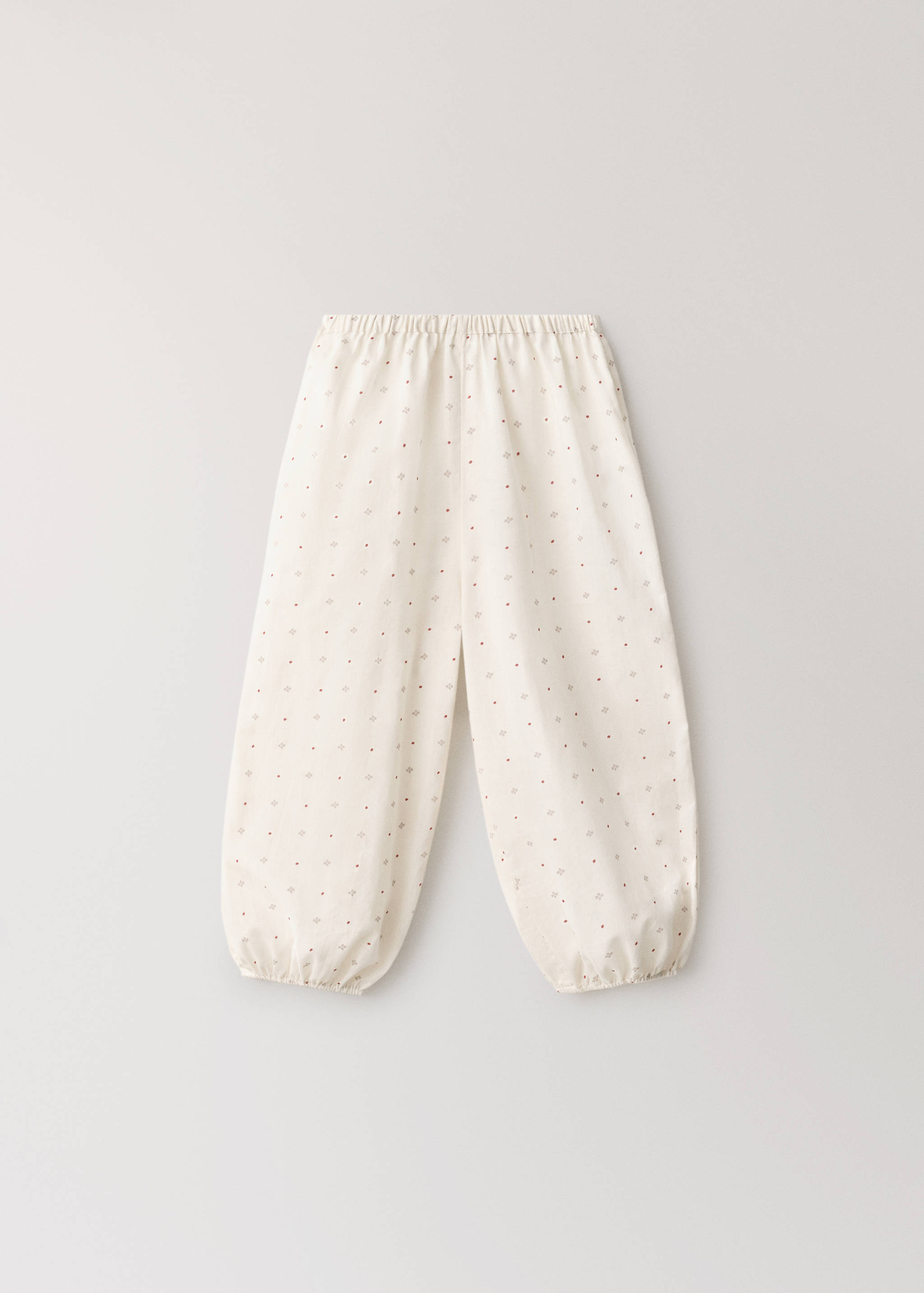 Cream patterned pyjama trousers with an elasticated waistband and cuffs.