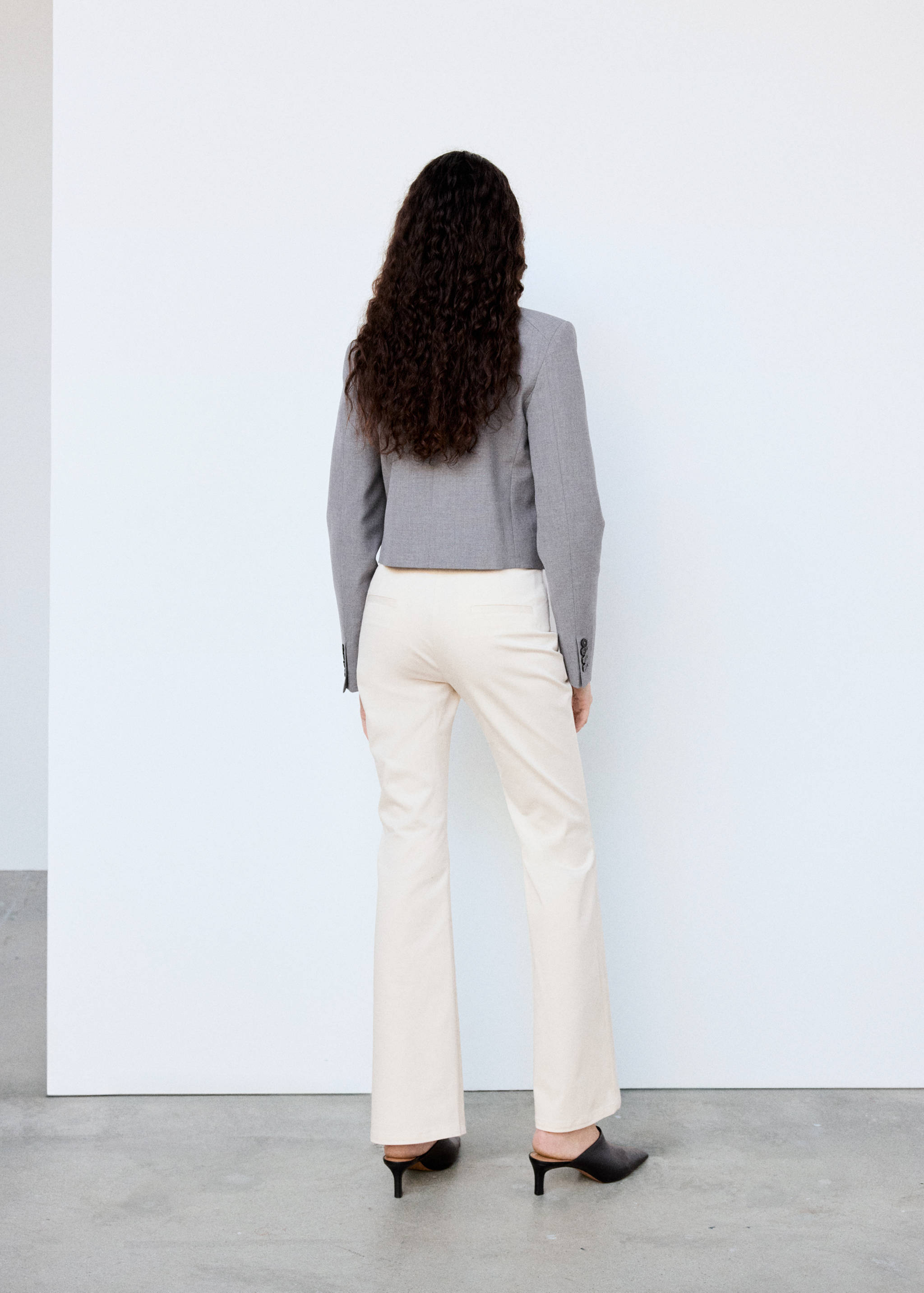 High-waisted flared trousers - Reverse of the article