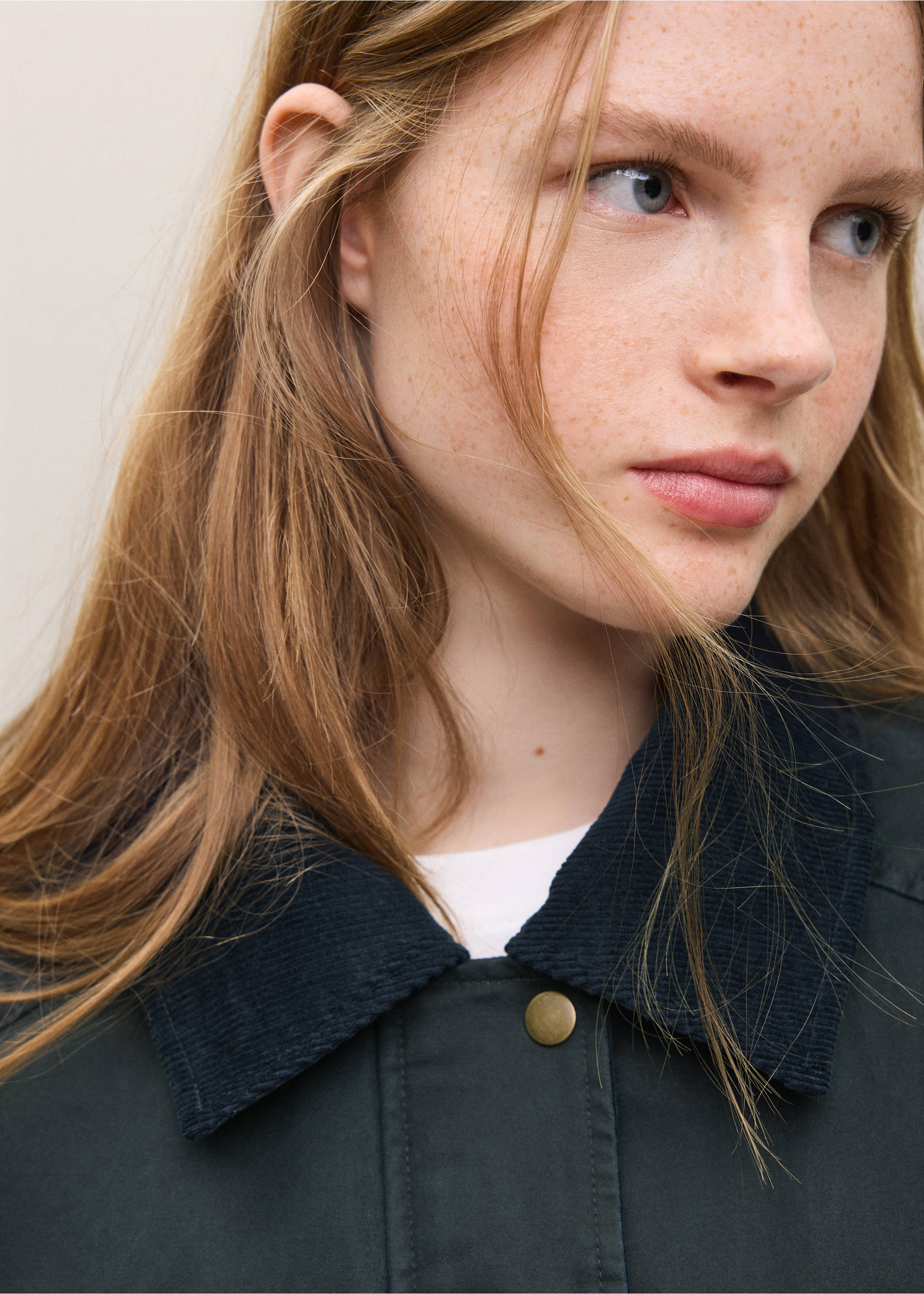 Close-up of a dark green parka with a black corduroy collar., Navy. Ref: 37035152-01.