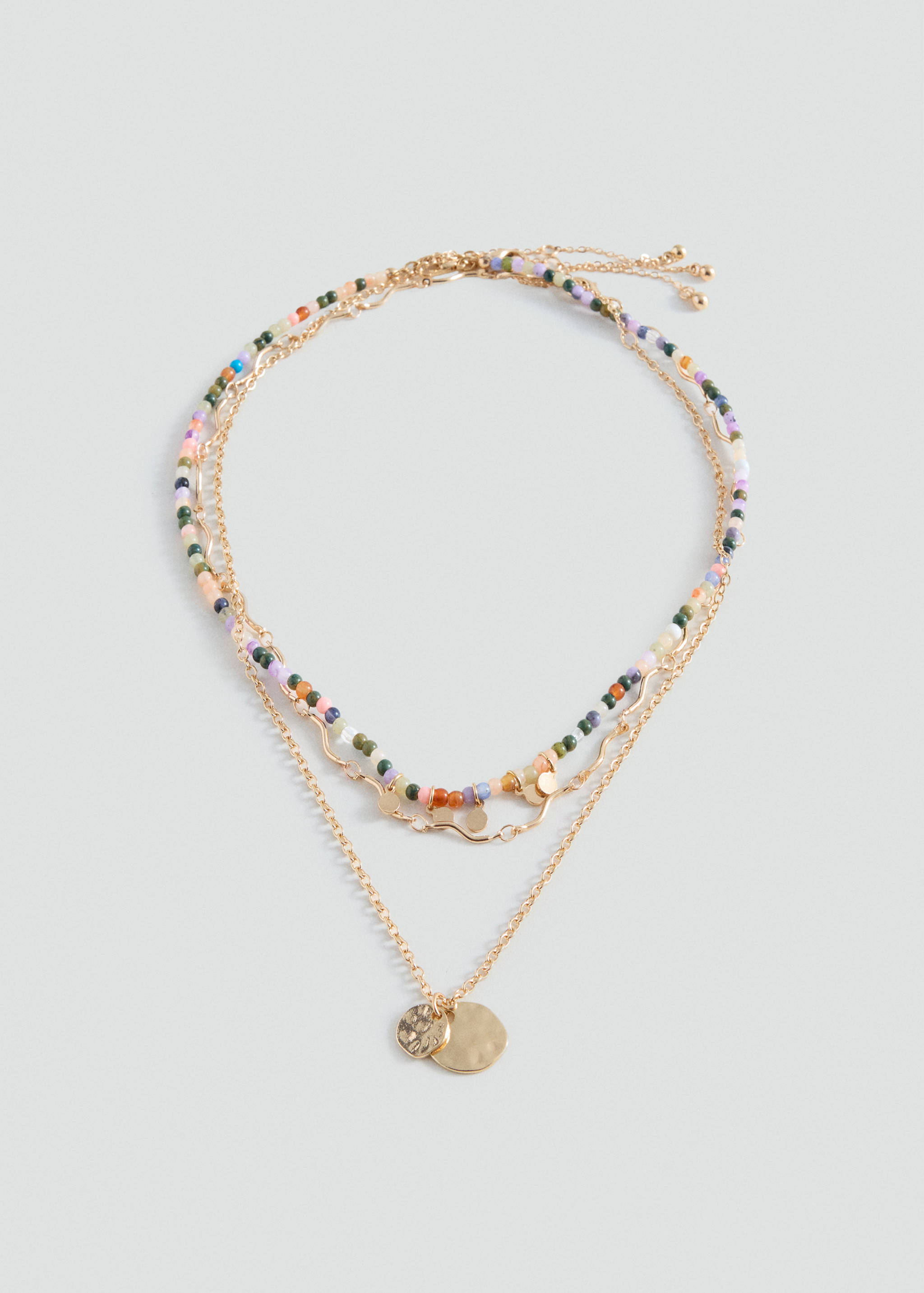 Multistrand gold necklace with colorful beads and textured coin charms.