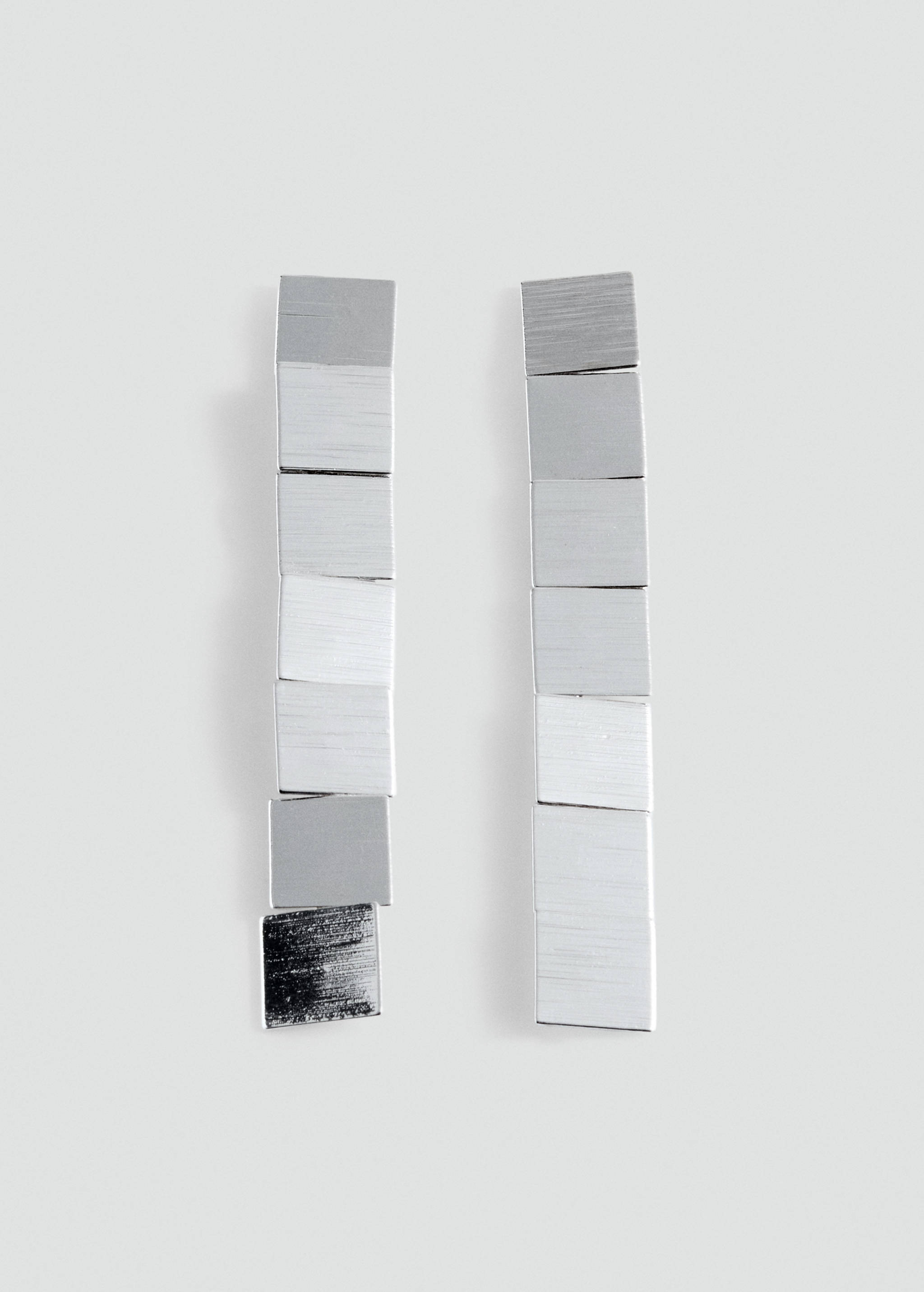 Silver-toned drop earrings featuring a vertical stack of brushed square metal links.