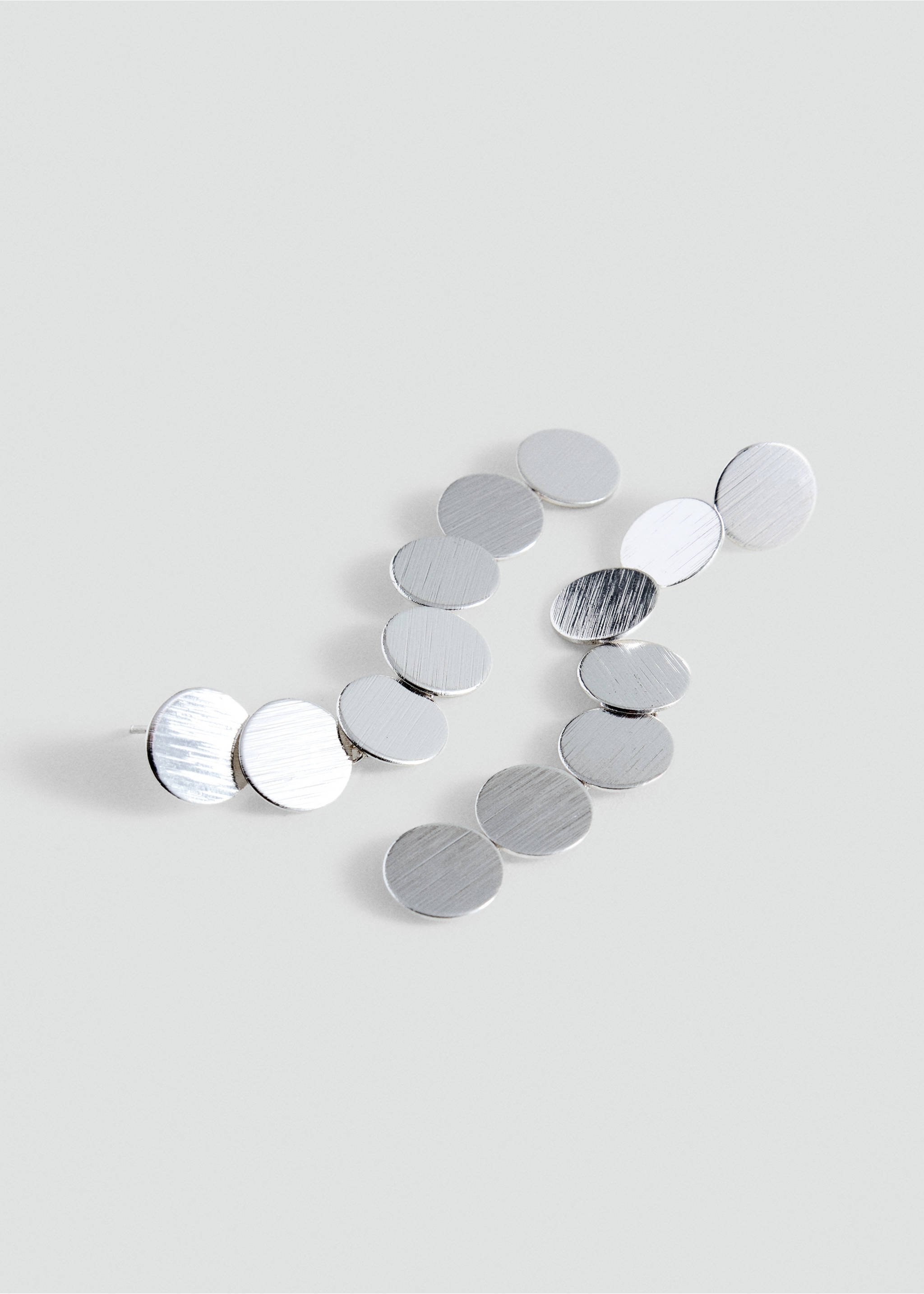 Silver-toned earrings featuring a curved line of brushed metallic discs., Silver. Ref: 37035182-00.