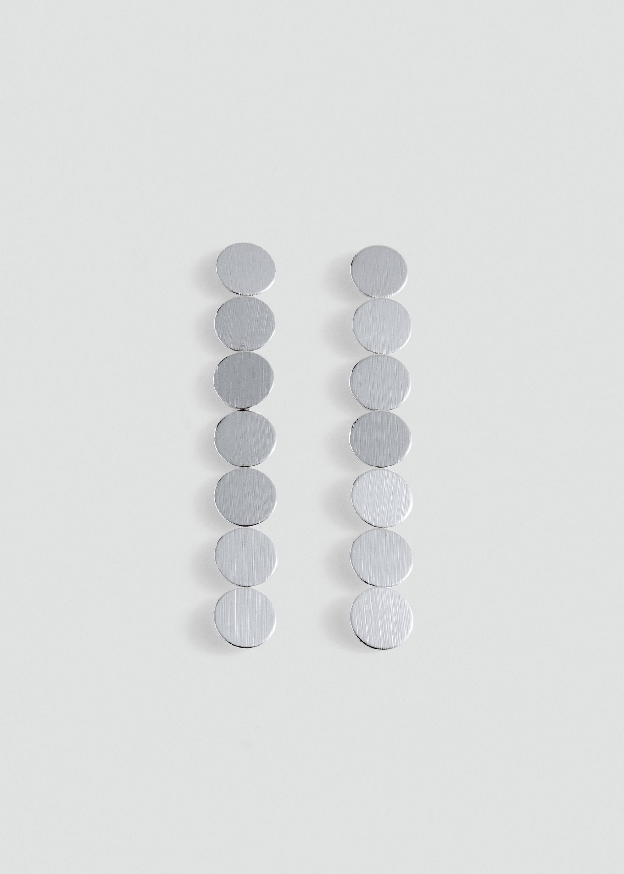 Silver-toned drop earrings with a vertical row of brushed circular discs.