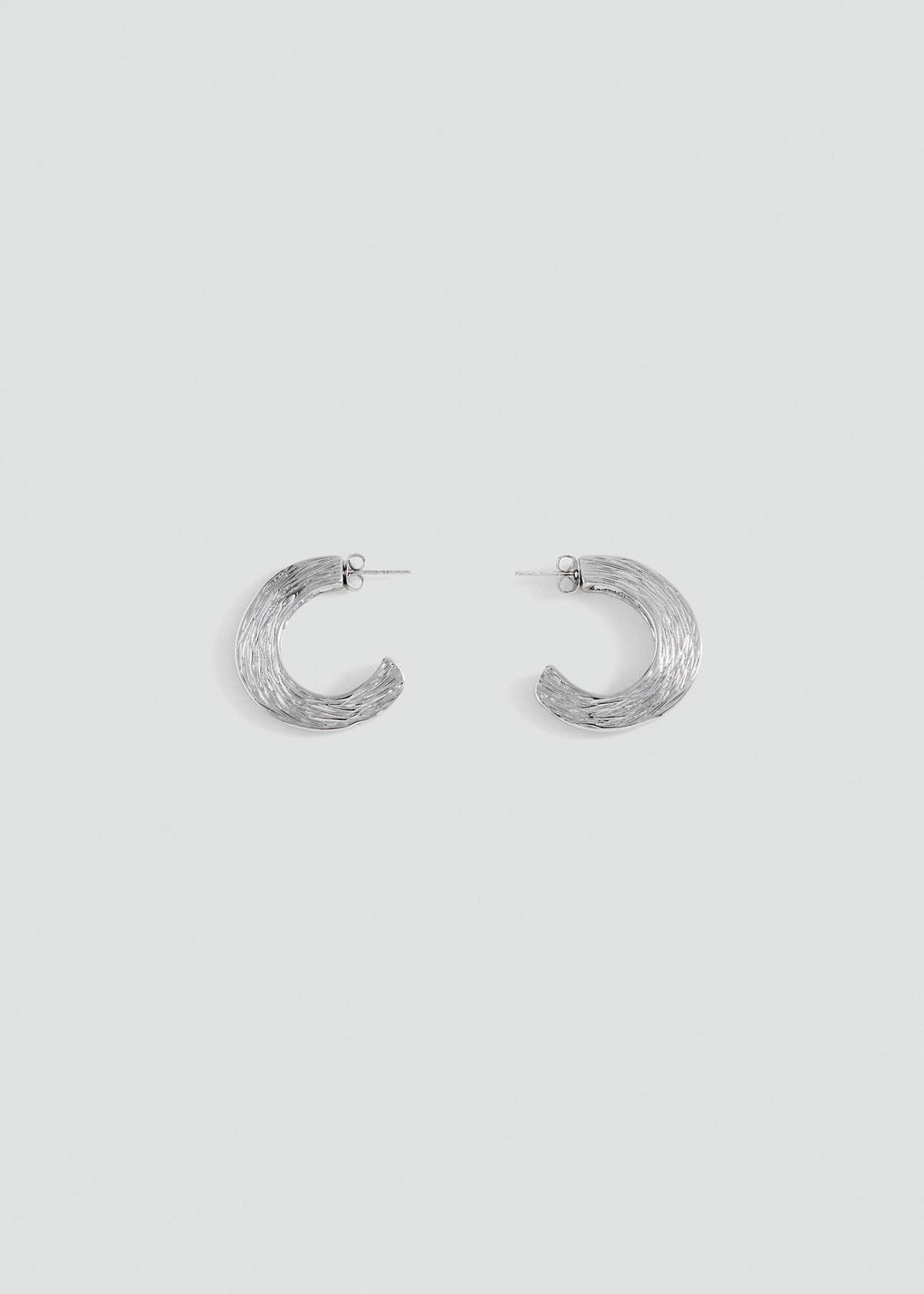 Textured hoop earrings — Silver