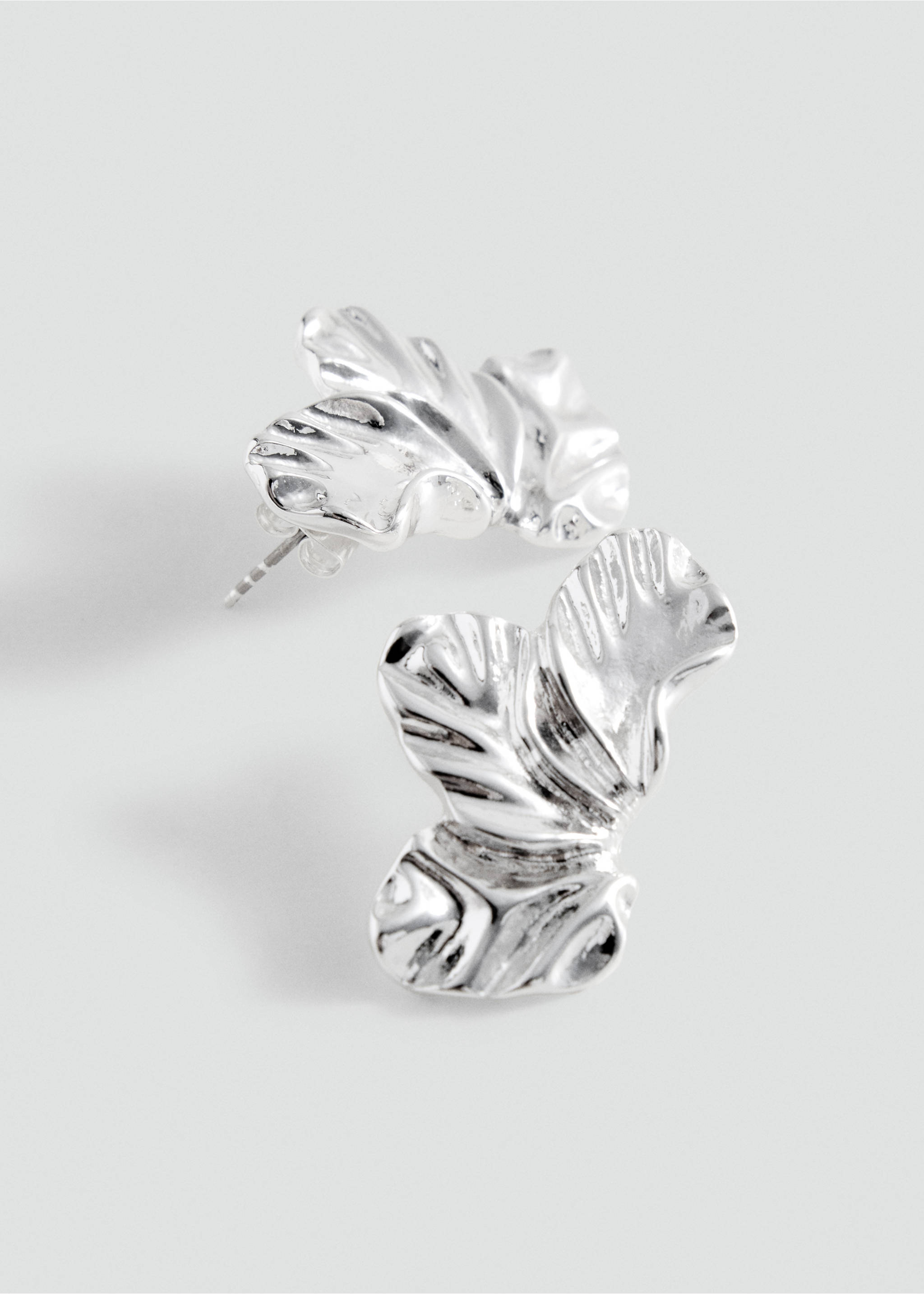 Silver earrings with an organic, textured leaf-like shape., Silver. Ref: 37035187-00.