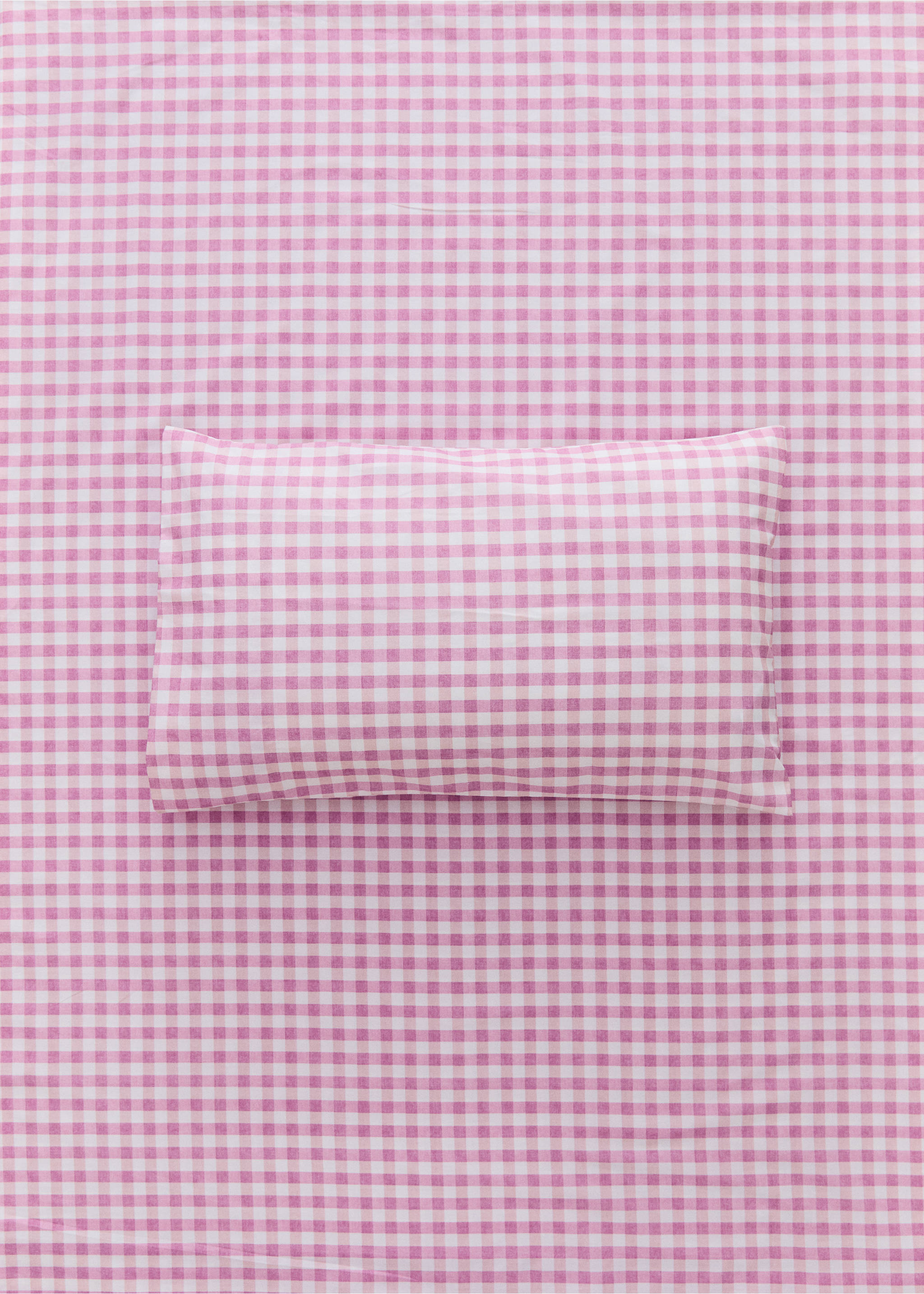 Pink and white gingham pillowcase on matching fabric background., Pink. Ref: 37035876-00.