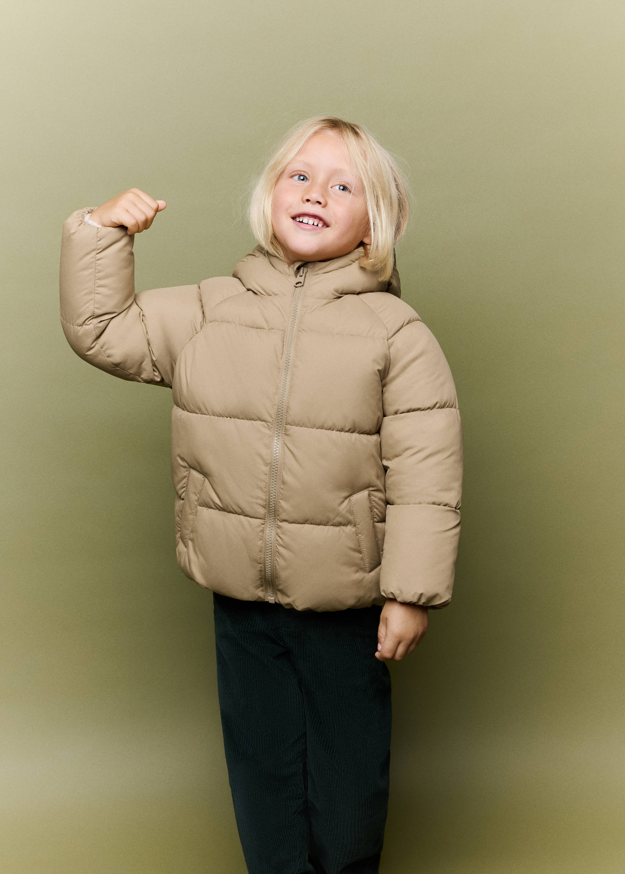 Beige hooded padded anorak with horizontal quilting and front zip.