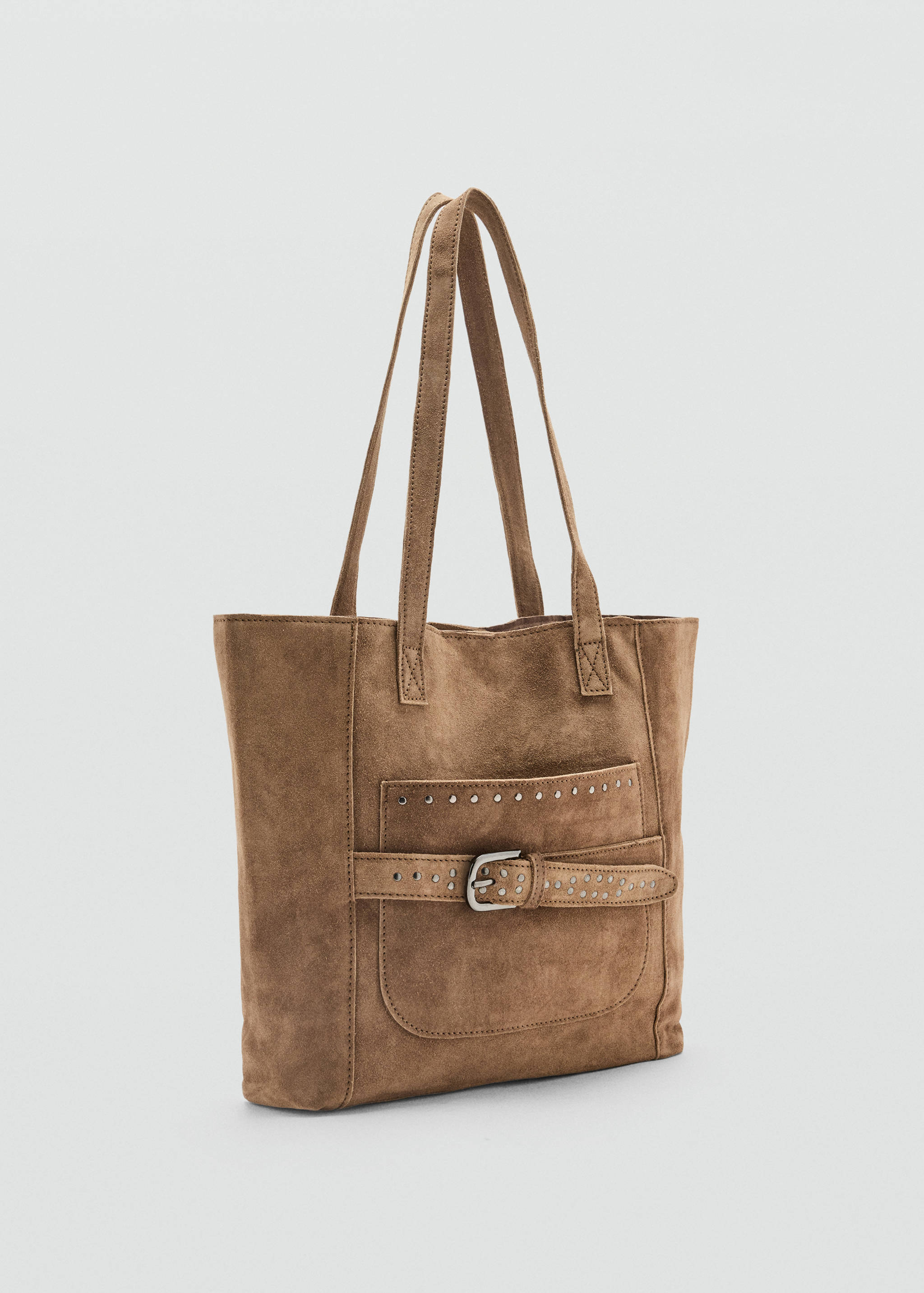 Brown suede tote bag with shoulder straps, a front pocket, silver studs, and a buckled strap.