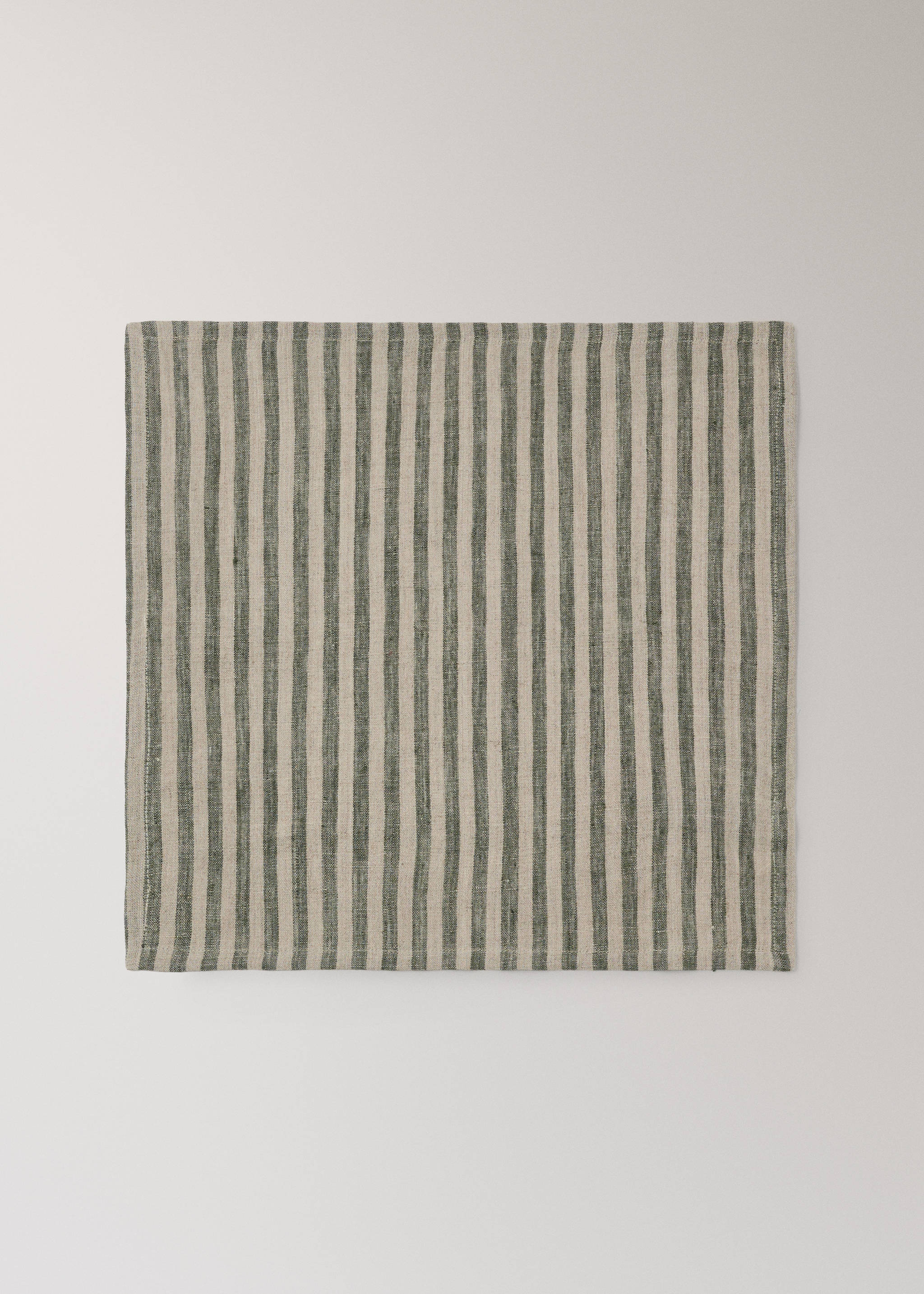 Green and beige striped napkin with a textured fabric finish.