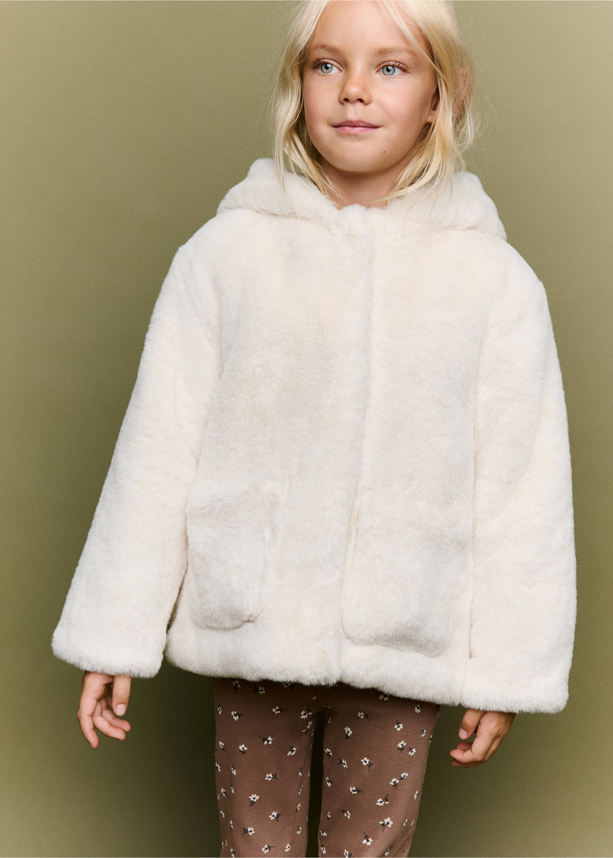 Off-white faux-fur hooded coat with front pockets worn with printed trousers., Off White. Ref: 37037115-00.