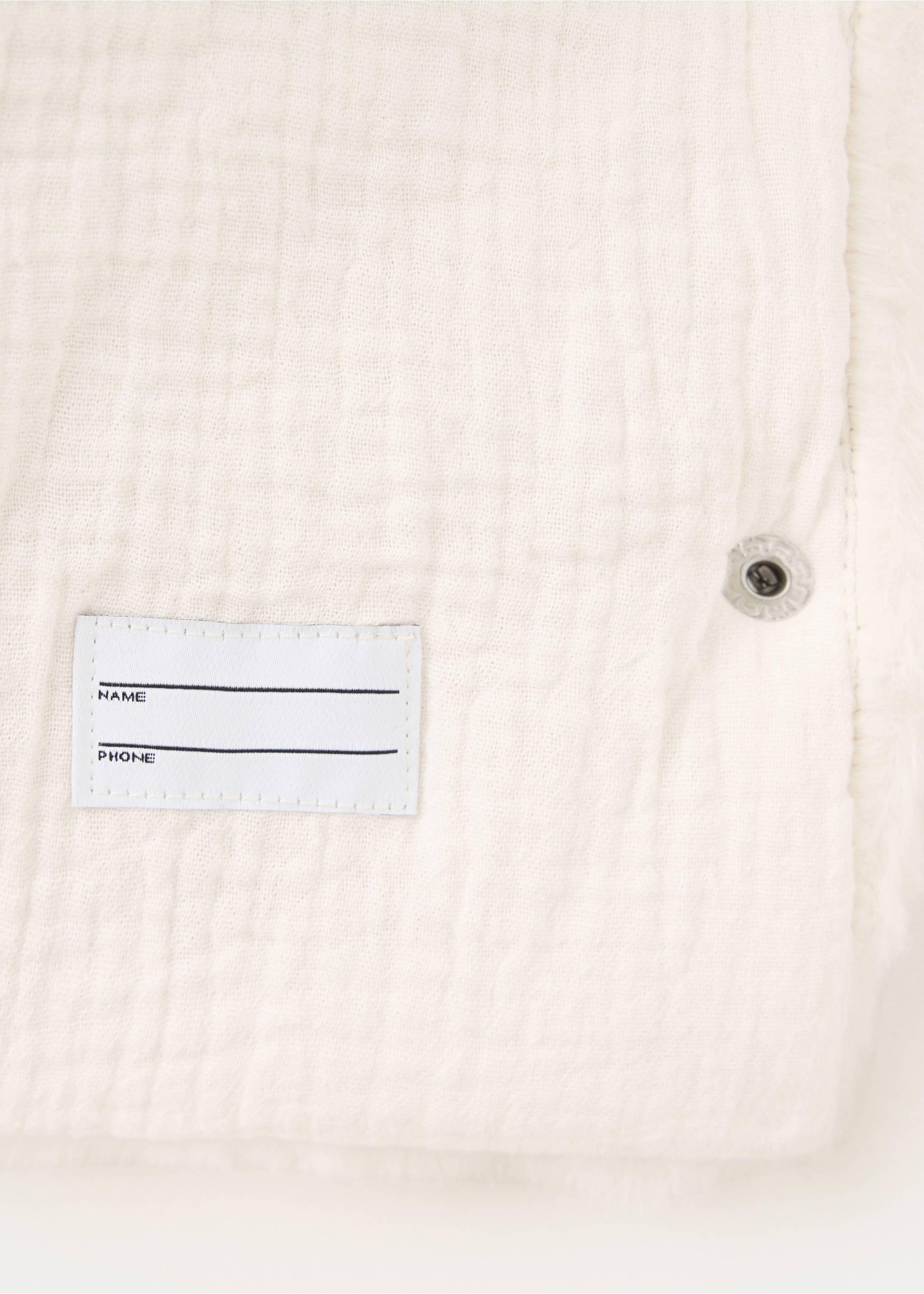 Close-up of a white coat showing a name tag detail., Off White. Ref: 37037115-00.
