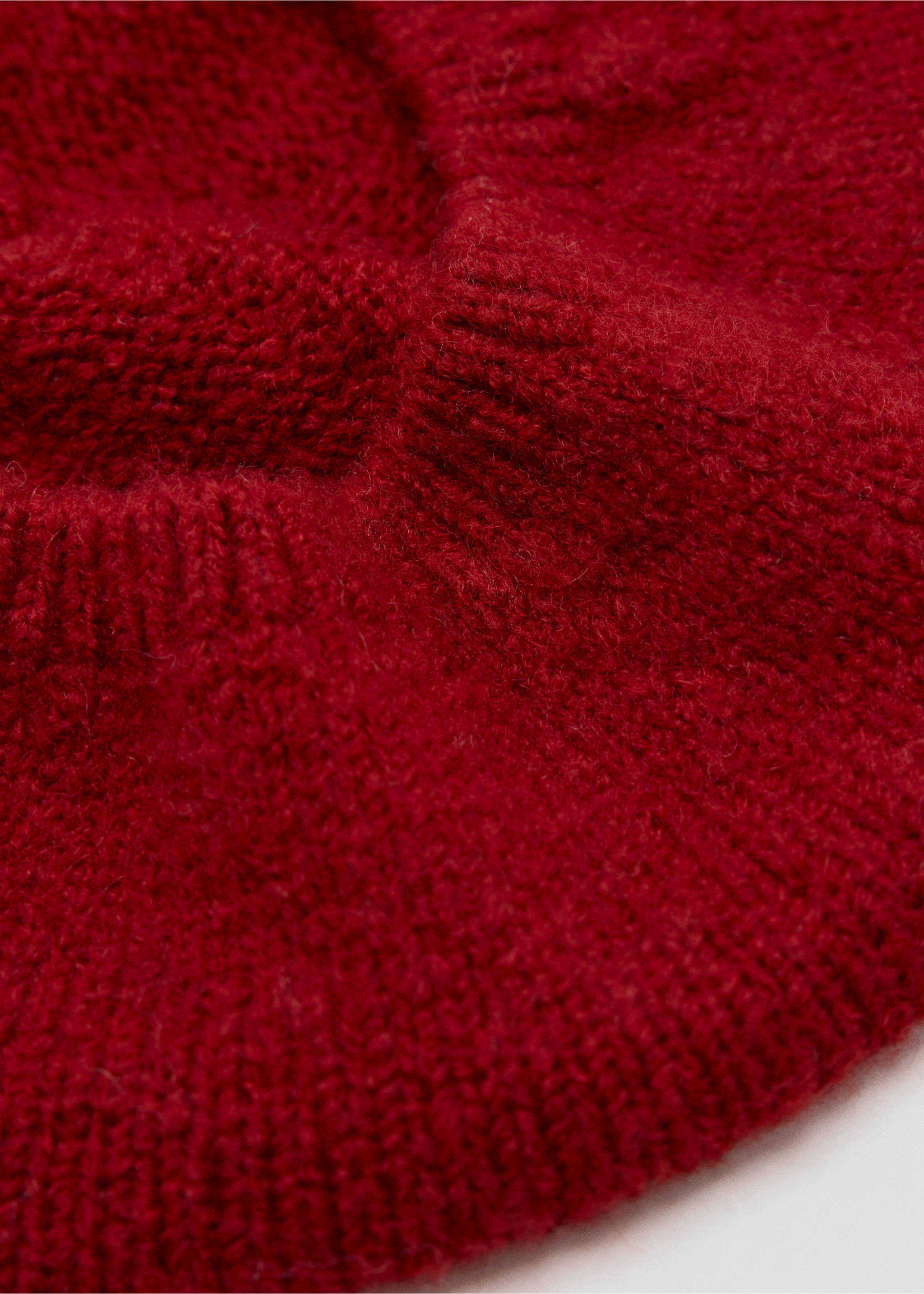 Close-up of a red knit beanie showing its fuzzy texture and ribbed cuff., Red. Ref: 37037120-00.
