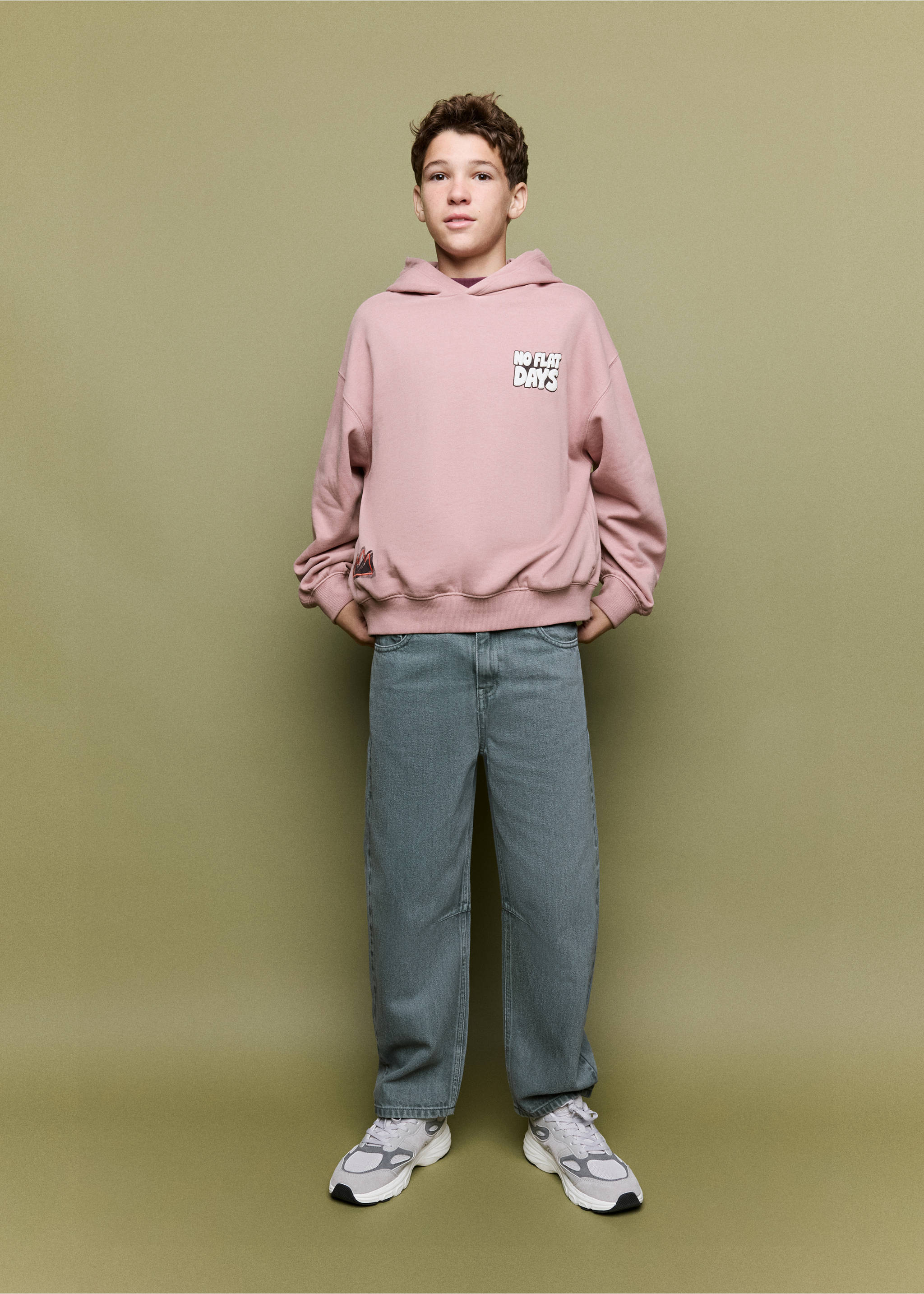 Pink hooded sweatshirt with white chest print, paired with grey-blue trousers., Pale Pink. Ref: 37037121-00.