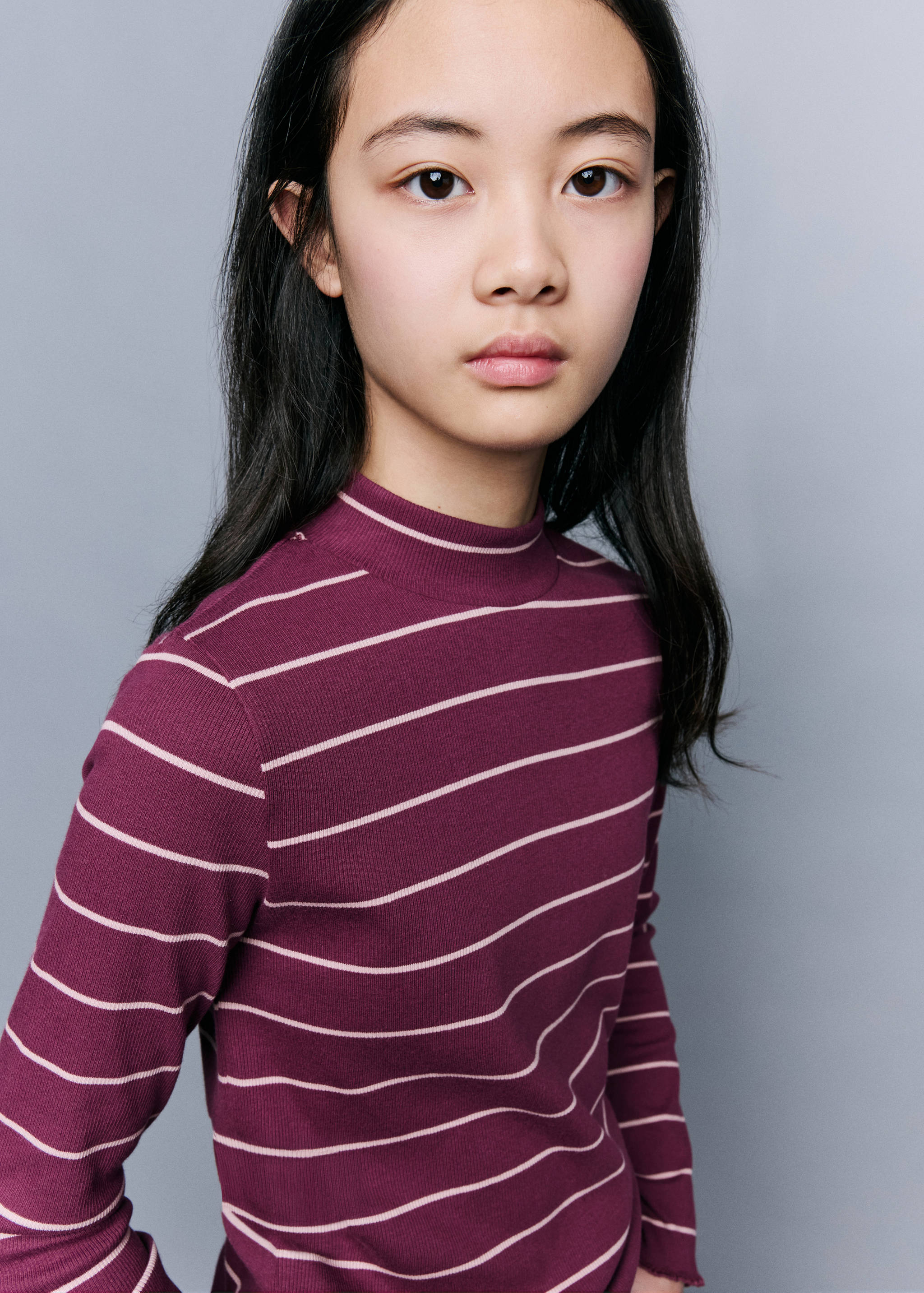Burgundy ribbed long-sleeved t-shirt with light pink horizontal stripes.