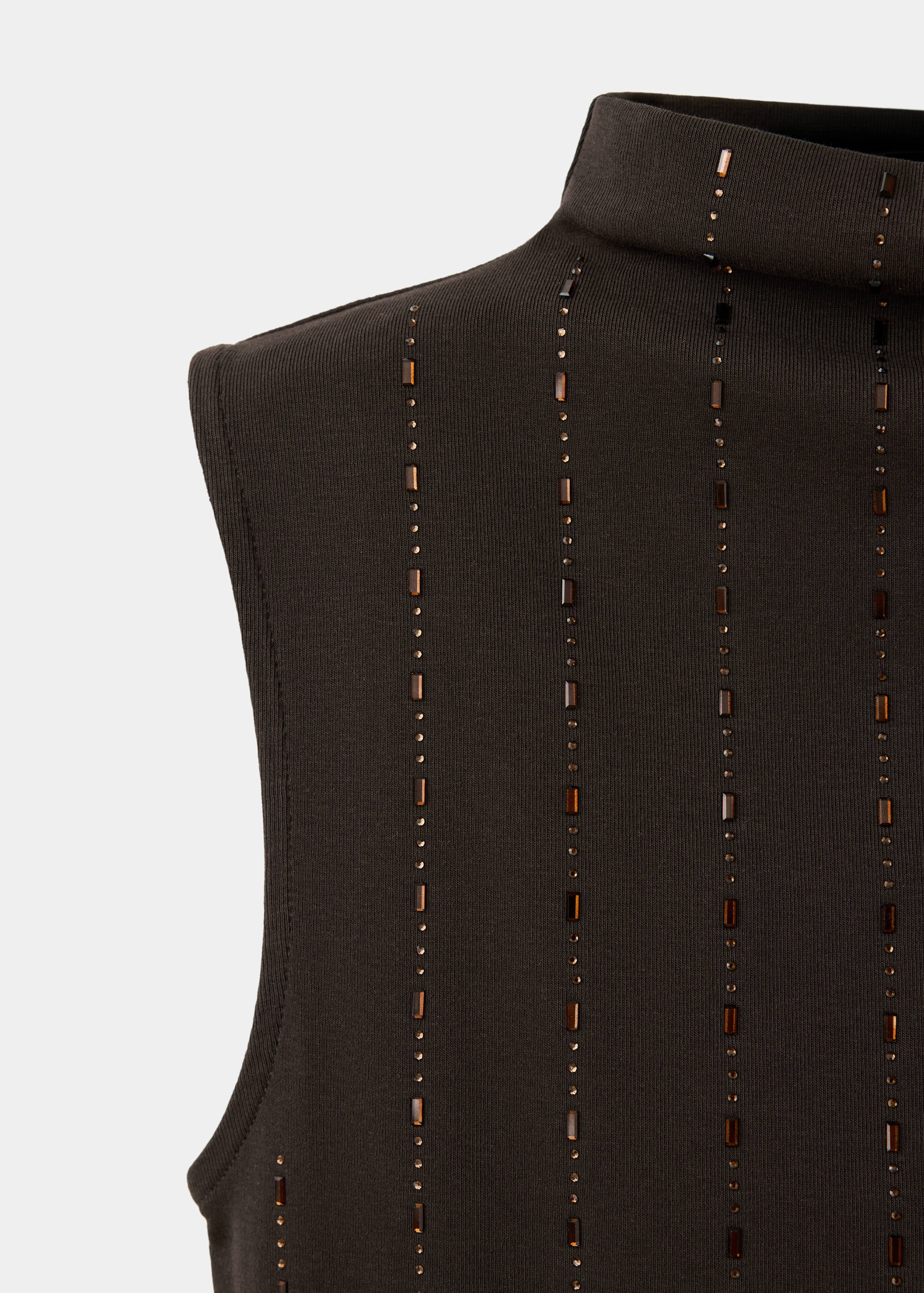 Close-up of a dark brown sleeveless top with rhinestone embellishments.